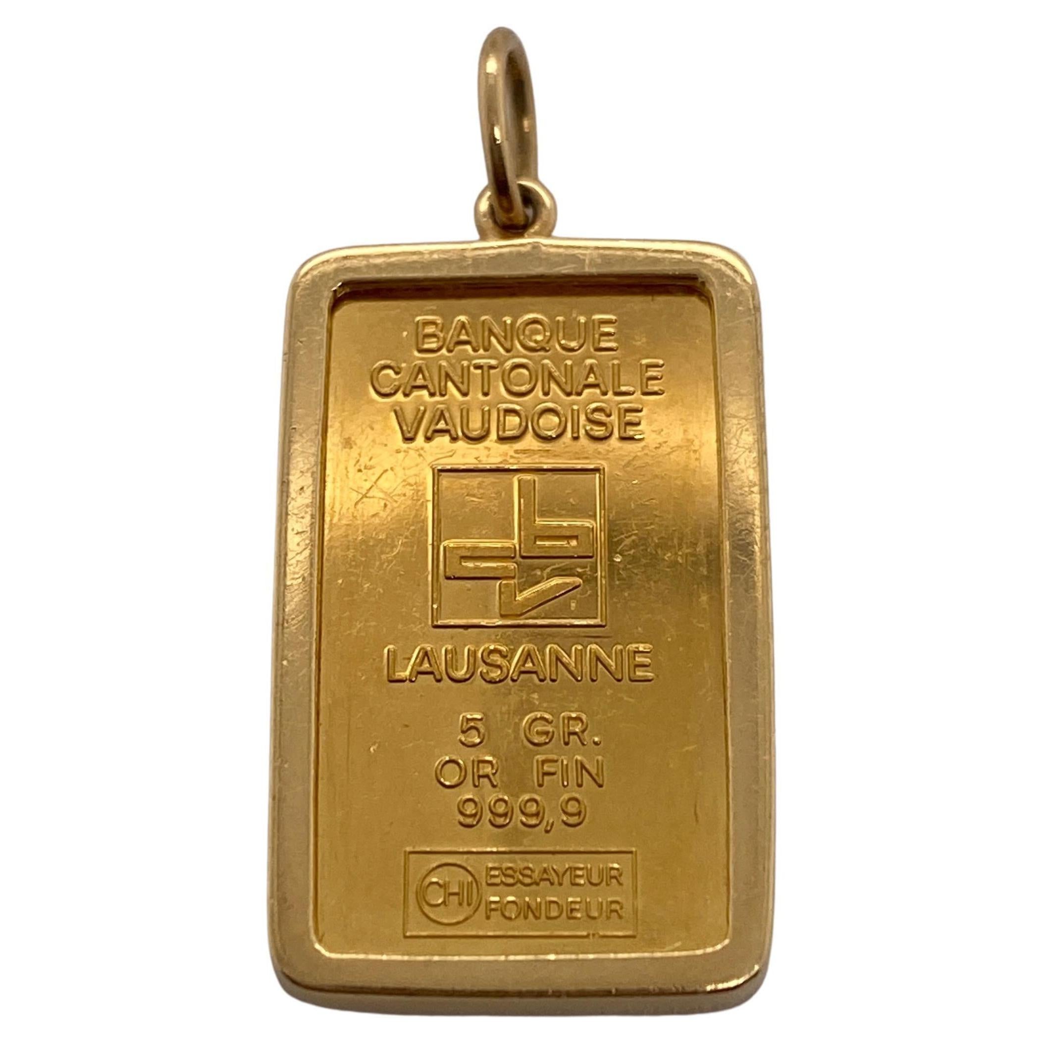 Lingotto d
oro 24K da 5g con ciondolo con cornice in oro giallo 14k