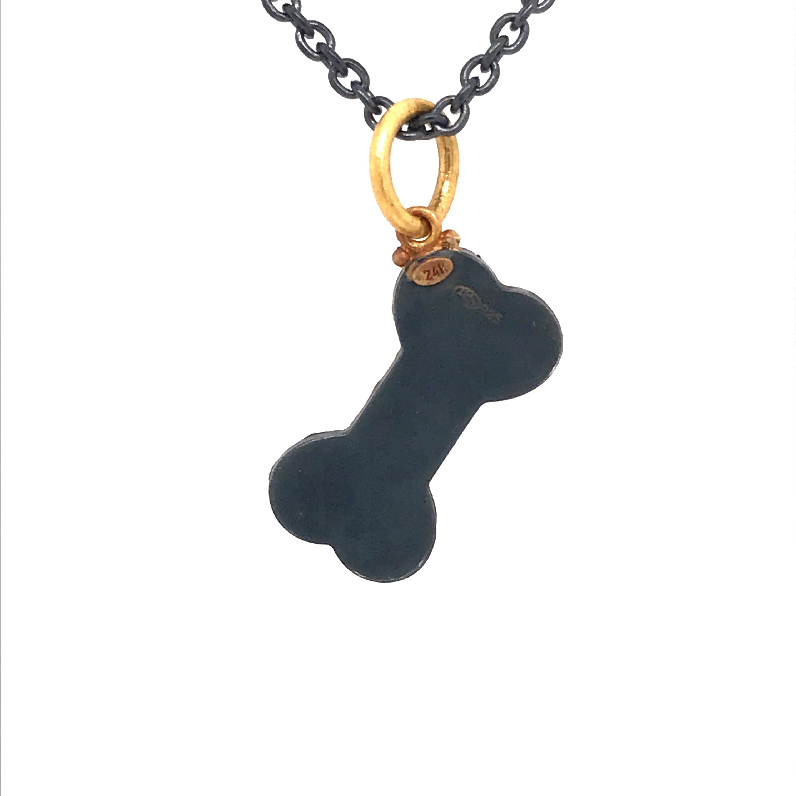 Modern 24 Karat Gold and Oxidized Sterling Silver Dog Bone Pendant With Diamonds For Sale
