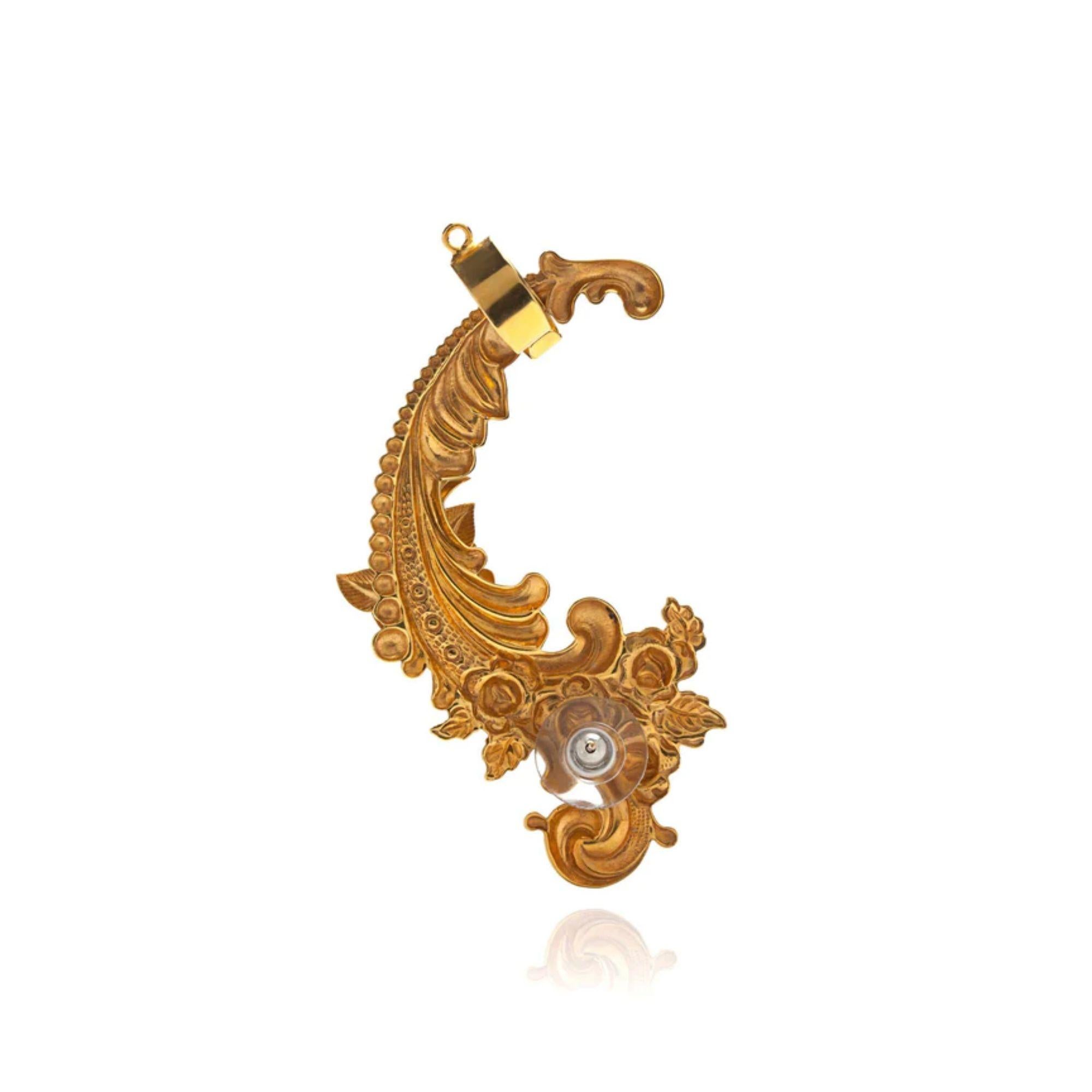 An opulent adornment to your ear. This full baroque fantasy for your ear is a royal upgrade for your auditory organ! In the back you have a stud as well an adjustable earcuff to securely hold up the piece. Made in America. Plated on