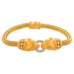 Bracciale in oro 24k per donna con doppia testa di pantera e diamanti
