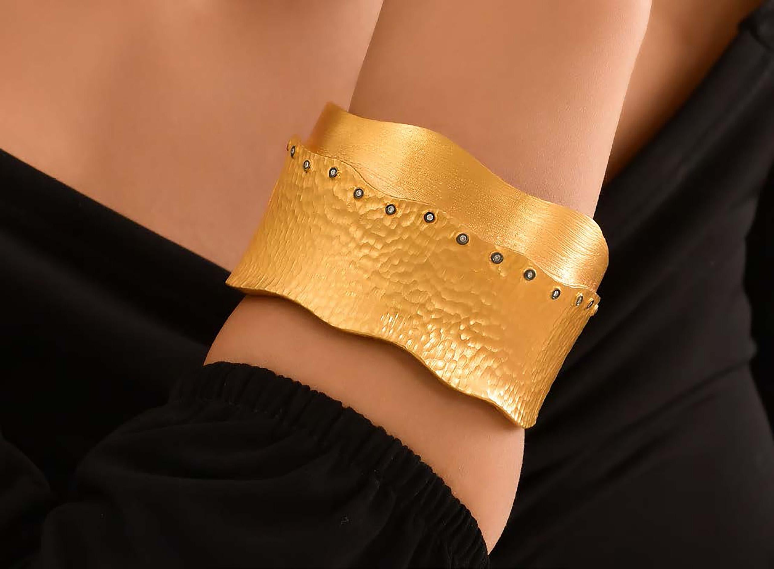 24K Gold Hinge Bangle Bracelet with Diamonds by Kurtulan. Cuff approximately 3 inches wide. Size Small-Medium
This piece is made to order and will take approximately 4-6 weeks for delivery.

ABOUT KURTULAN JEWELLERY OF INSTANBUL, TURKEY:
Kurtulan