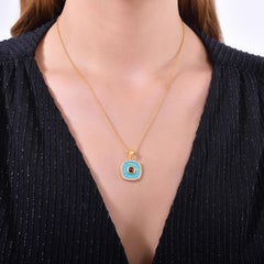 Colgante de Oro de 24K para Mujer con Esmalte Azul y Rubí talla Pan de Azúcar y Diamantes