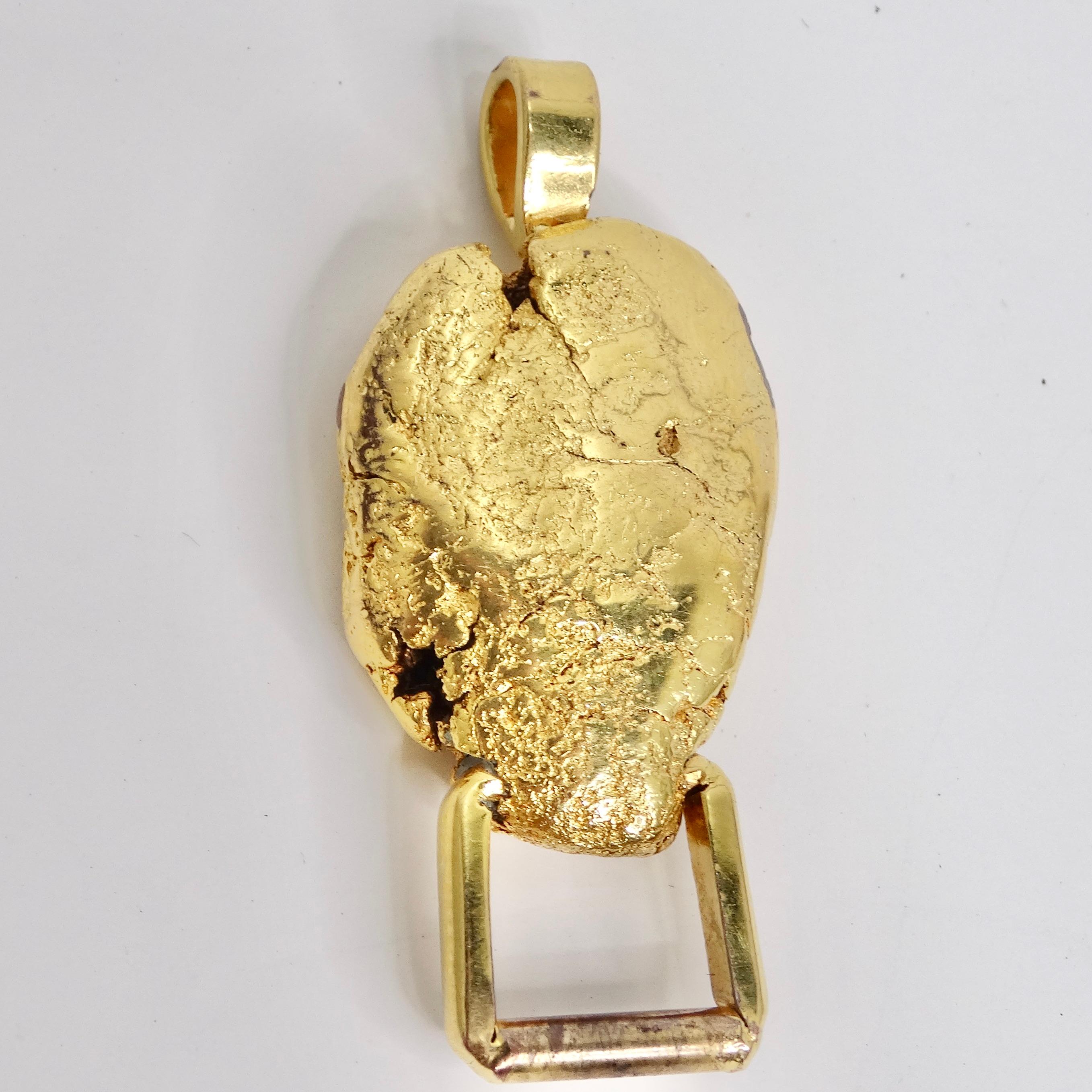 Step back in time to the glamour of the 1980s with our exquisite 24K Gold Plated Nugget Pendant. This classic nugget-style pendant boasts a luxurious 24K gold plating, a testament to its timeless elegance. The gleaming yellow gold is not just chic;