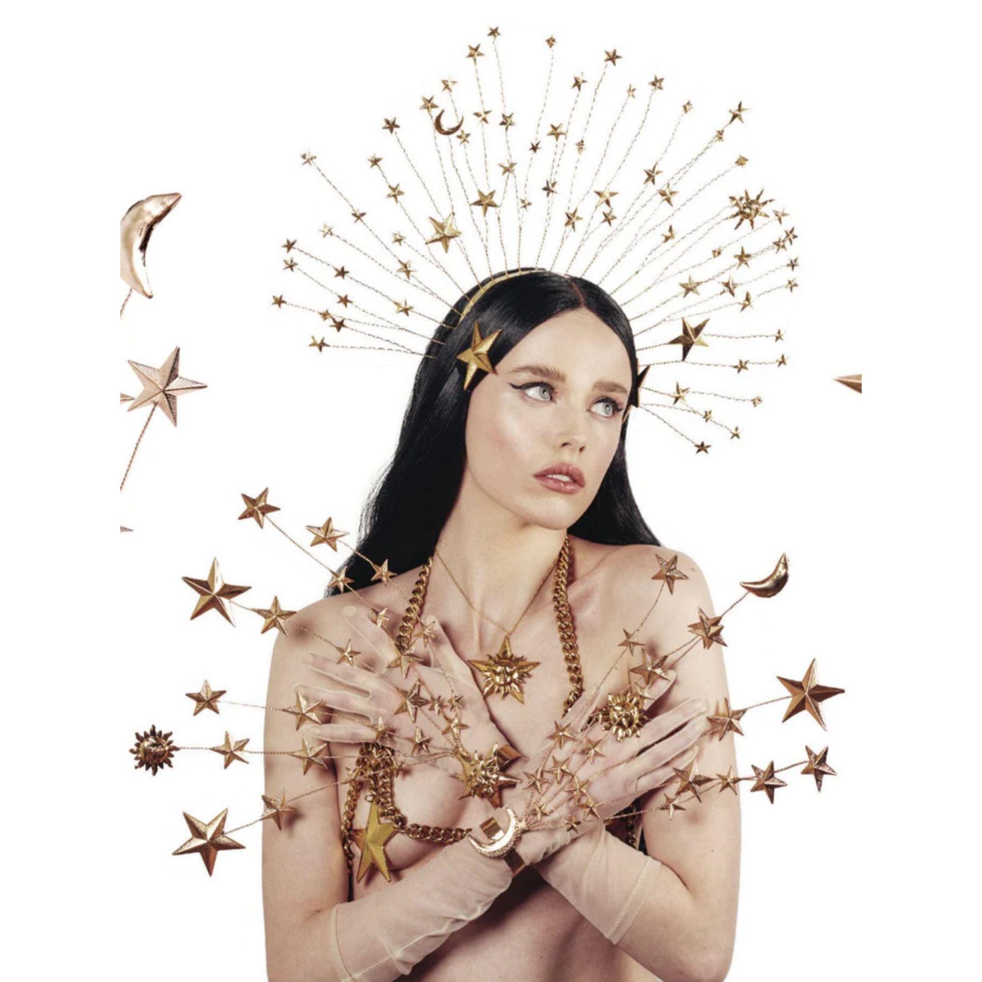 Illuminate your style with this celestial-inspired Star and Sun Face Pendant Necklace by Mordekai. Handcrafted in brass and plated in radiant 24K gold, the necklace features a striking five-pointed star with a sculptural sun face at the