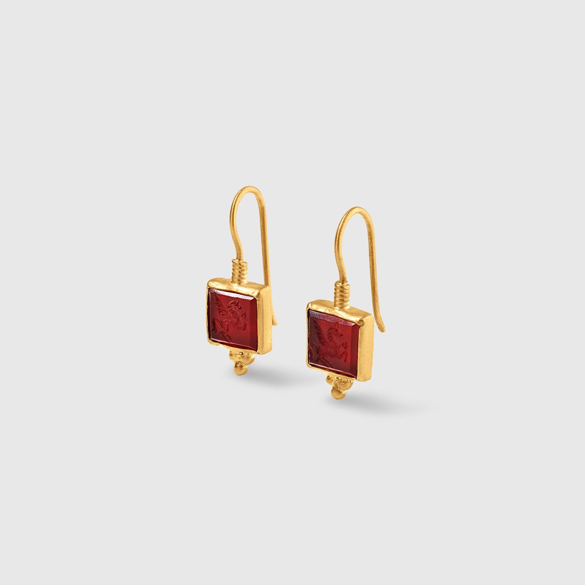 Carved red agate with Pegasus earrings with 24K yellow gold-fused on sterling silver. By Kurtulan Jewellery of Istanbul Turkey.  Delicate drop earrings with carved Pegasus detail.

ABOUT KURTULAN JEWELLERY OF INSTANBUL, TURKEY:
Kurtulan jewellery