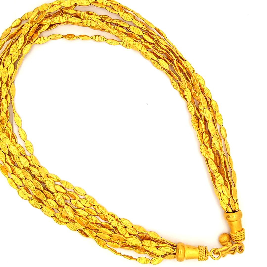 24K Yellow Gold (10) strand Necklace with hammered gold links. The necklace weighs 82.89 grams, 17 1/2 inches in length.
