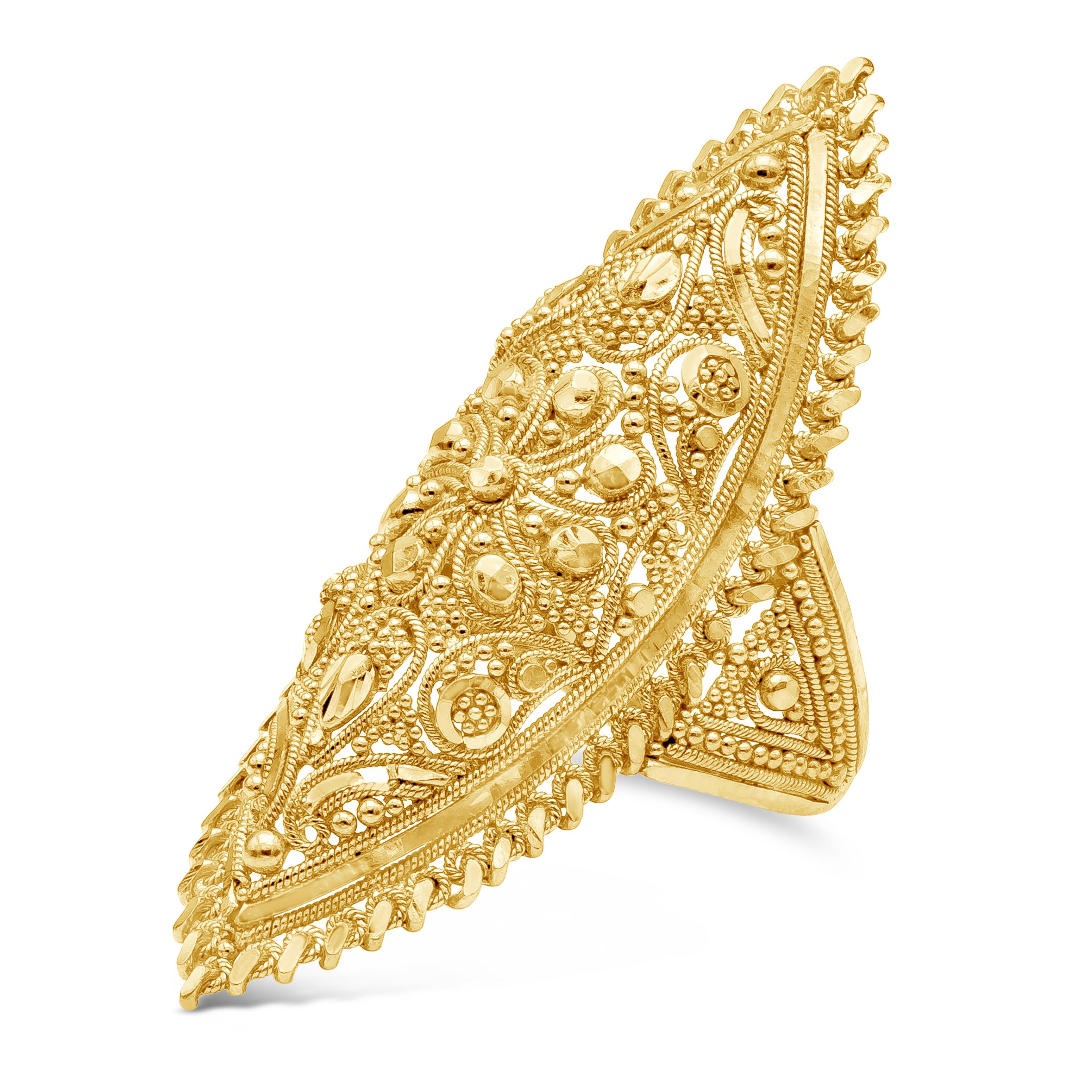 An elongated antique ornate fashion ring showcasing a distinct east asia design. Made with 24K Yellow Gold. 9.37 Grams of Gold, Size 7.5 US