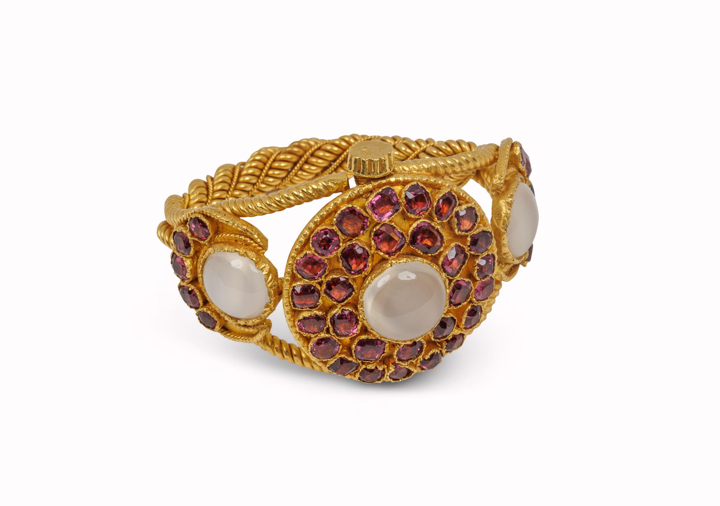 24k Yellow Gold Heavy Moonstone and Garnet Bangle Bracelet 
approximately 3 moonstones weight 34cts  
36cts garnets 
