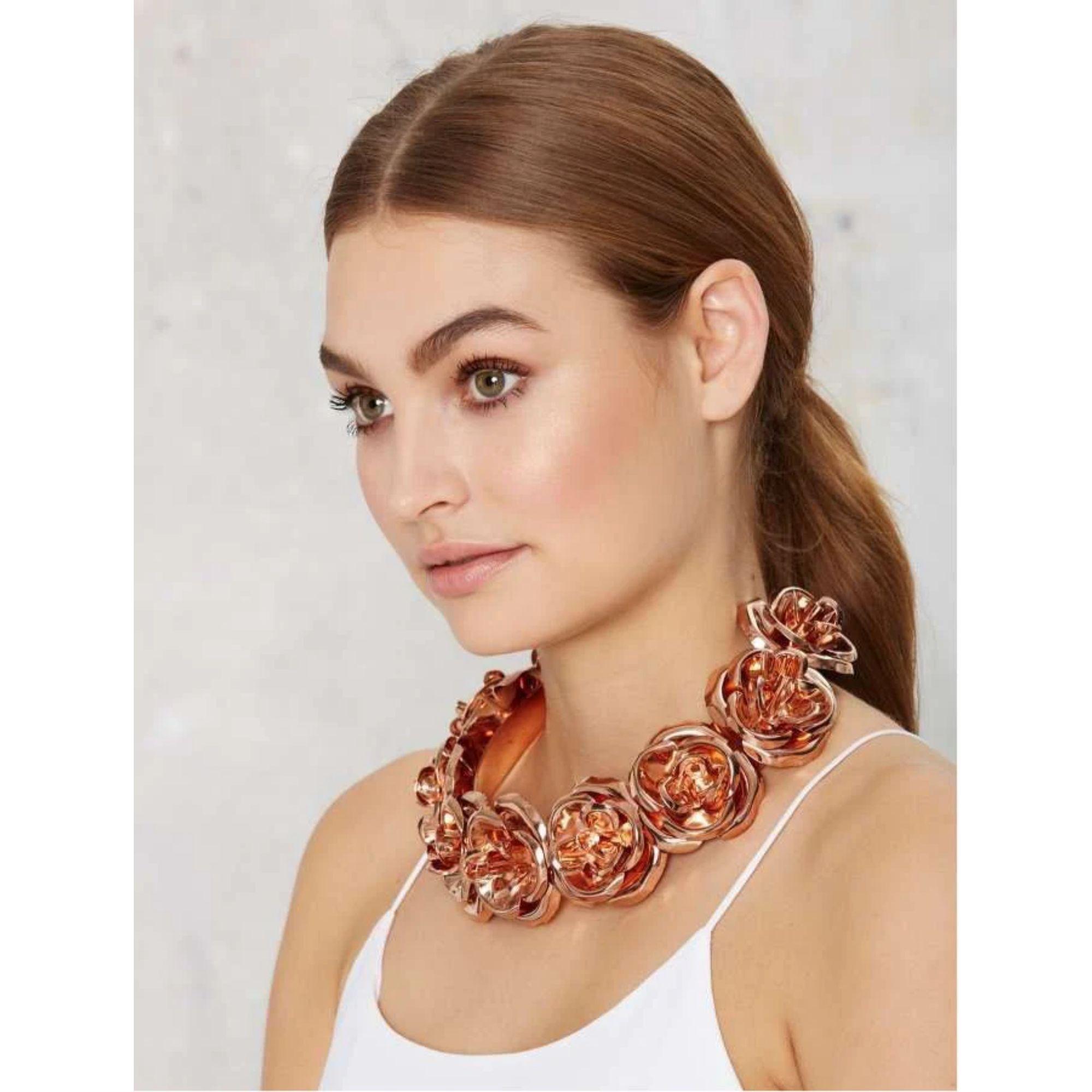 Striking floral adornment for your neck so strong you can smell the intoxicating scent of the roses! Handmade and available in three finishes, this choker is a must for a complete ensemble! Mordekai staple piece. Made in America. Brass