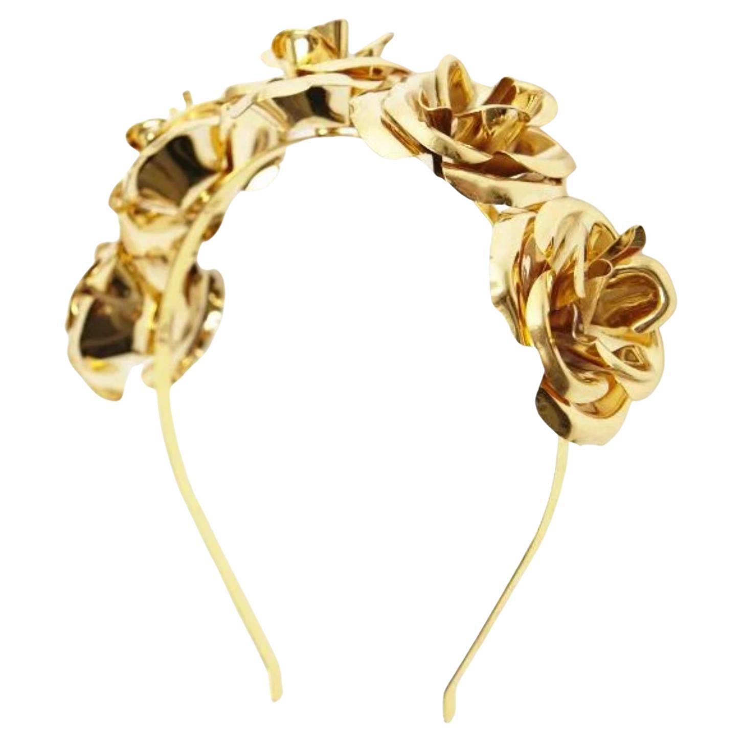 A modern industrial take on a classic, this Mordekai headband is unlike anything in the market! A special process dedicated mostly for furniture called powder coating was used to coat the brass roses in baby pink. Worn famously by Erika Jayne for