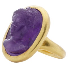 Antique  24kt. yellow gold carved amethyst intaglio ring with a woman's portrait