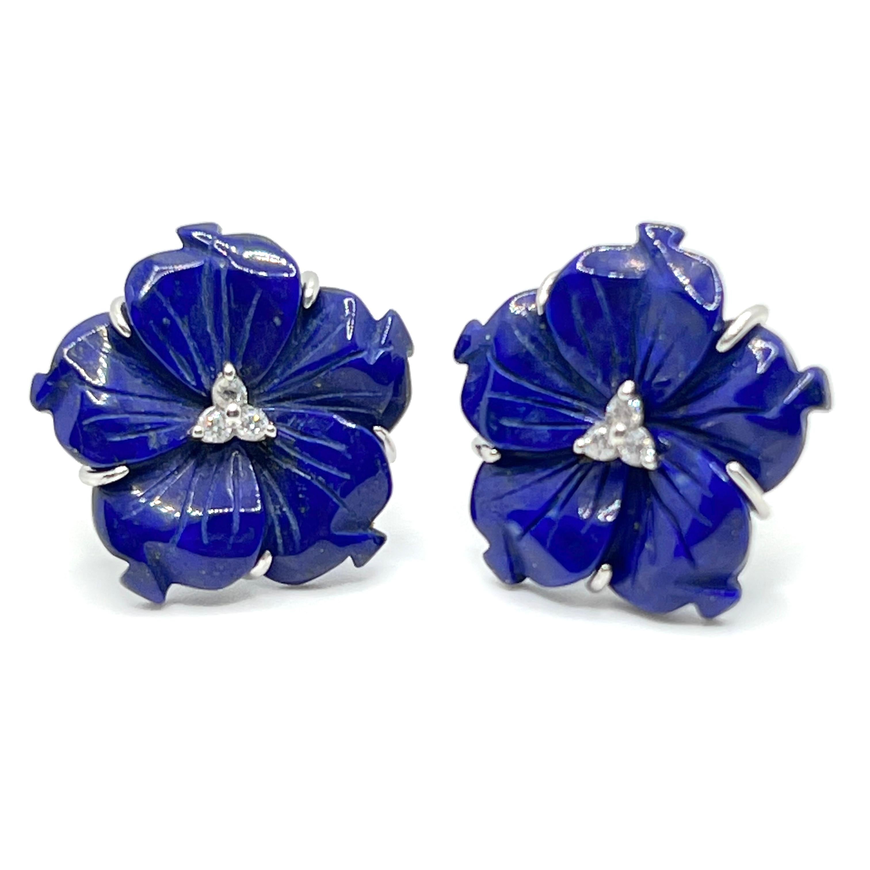 Elegant 24mm Carved Lapis Lazuli Flower Earrings

This gorgeous pair of earrings features 24mm lapis lazuli carved into beautiful 3D flower, adorned with round simulated diamonds in the center, handset in platinum rhodium plated sterling silver.