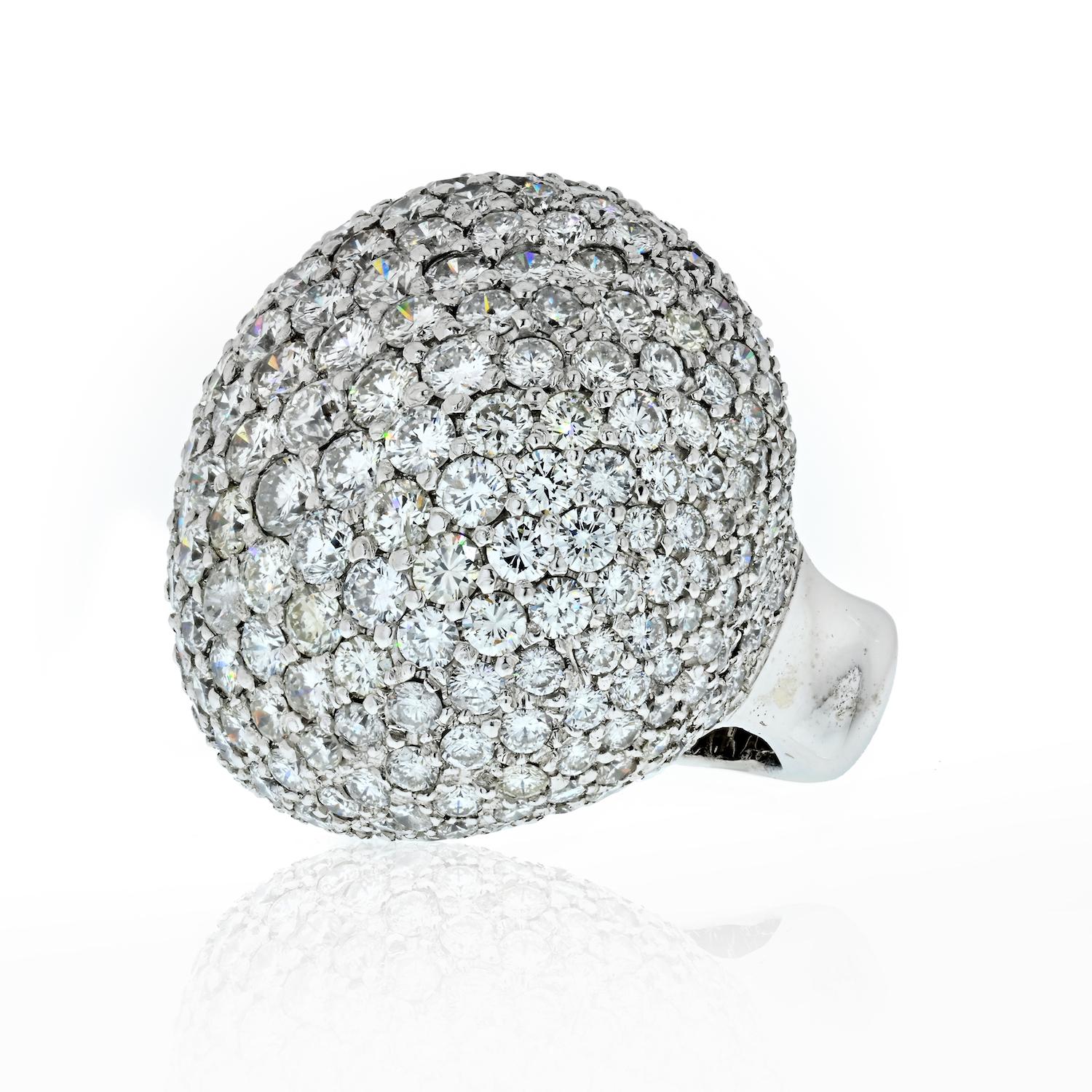 Prepare to dazzle with the opulent brilliance of this oversized dome ring, adorned with a million icy white diamonds totaling an impressive 25 carats. Crafted in classic 18K white gold, this luxurious ring is designed for those who seek the epitome