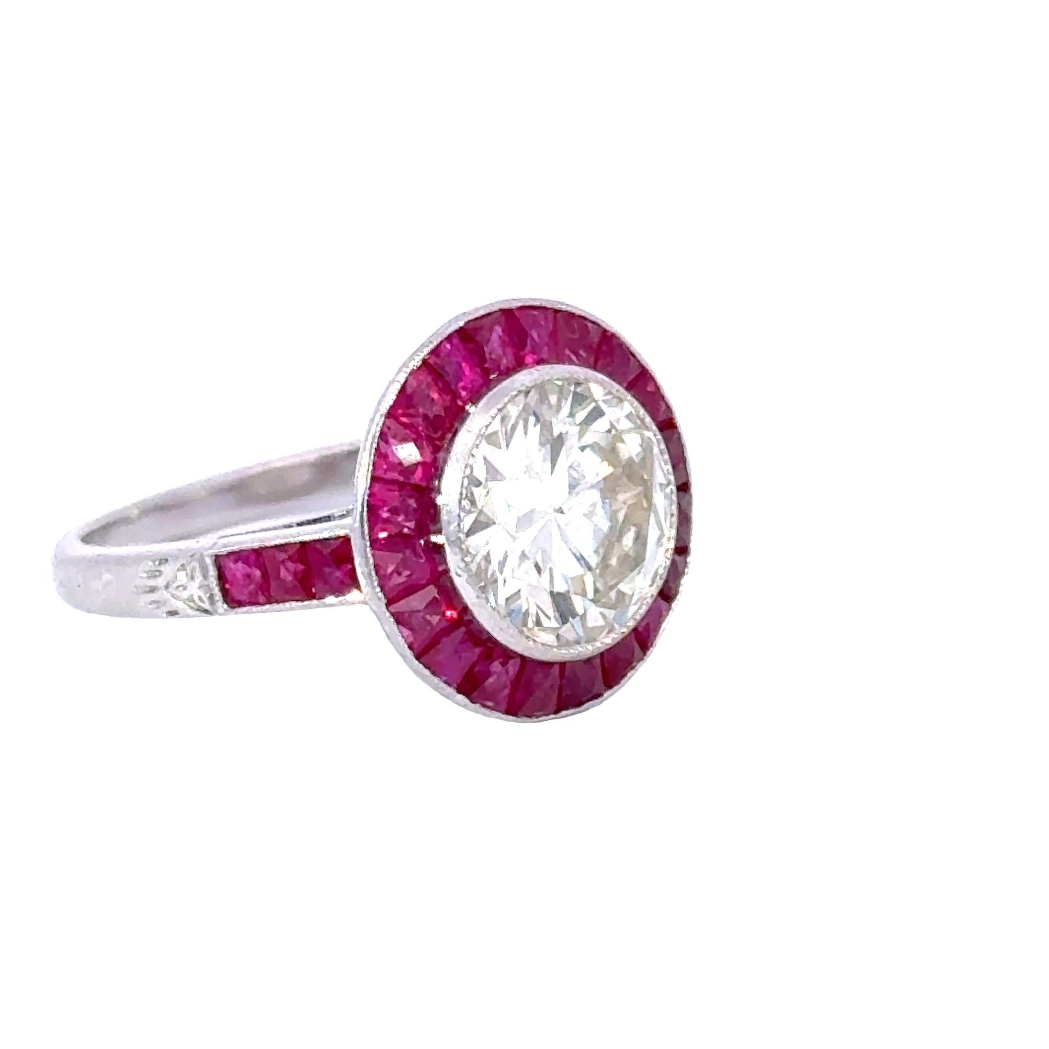 This stunning Diamond, Ruby, Platinum Ring is a true masterpiece that exudes elegance and luxury. Crafted with meticulous attention to detail, it captivates with its radiant design and exceptional gemstones.

At the heart of this ring are round