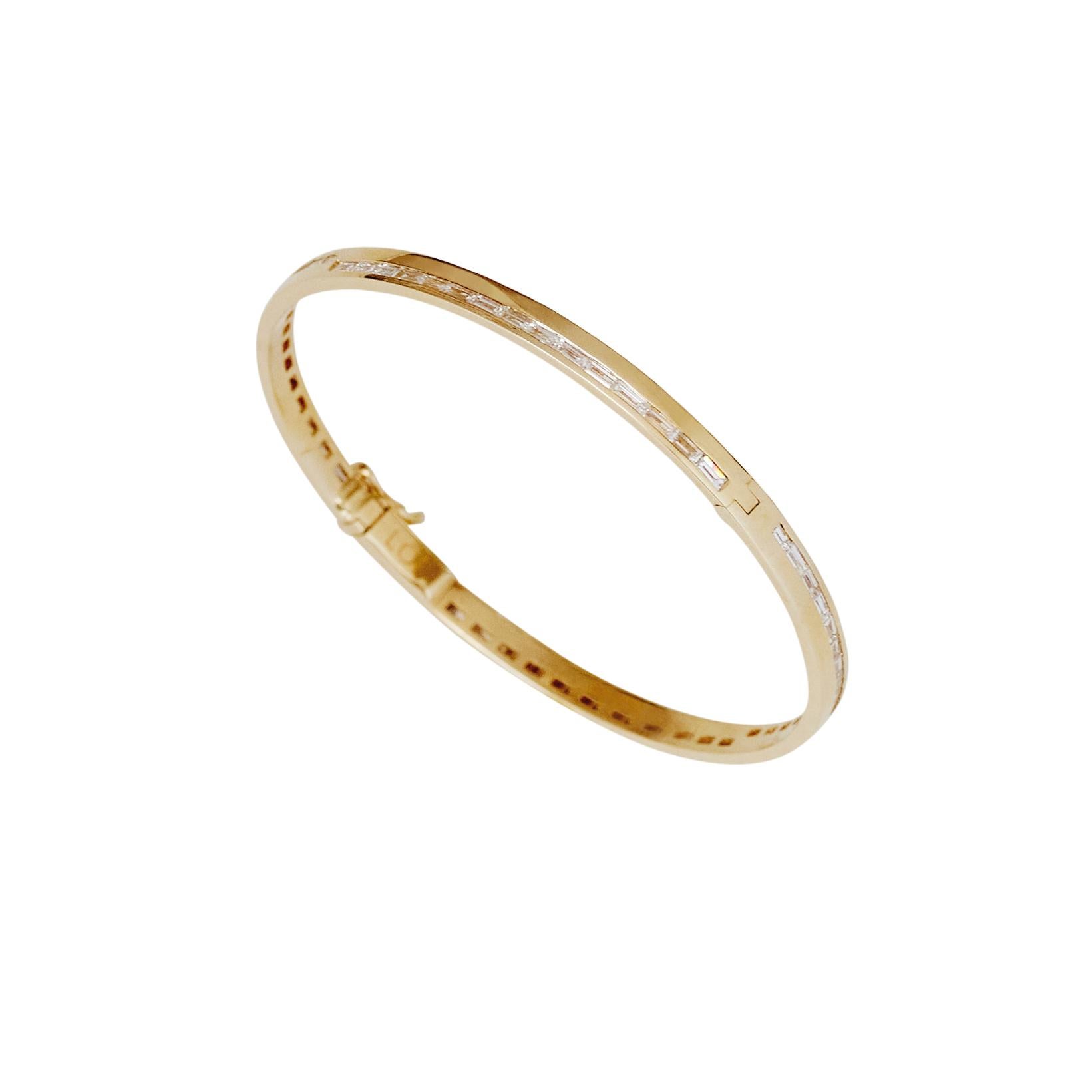 The Zelda Bracelet: A modern twist of a tennis bracelet and a bold expression of Art Deco sophistication, the Zelda Bangle is a study in balance, geometry, and refined luxury. Crafted in 18k solid gold, its structured form is punctuated by precisely