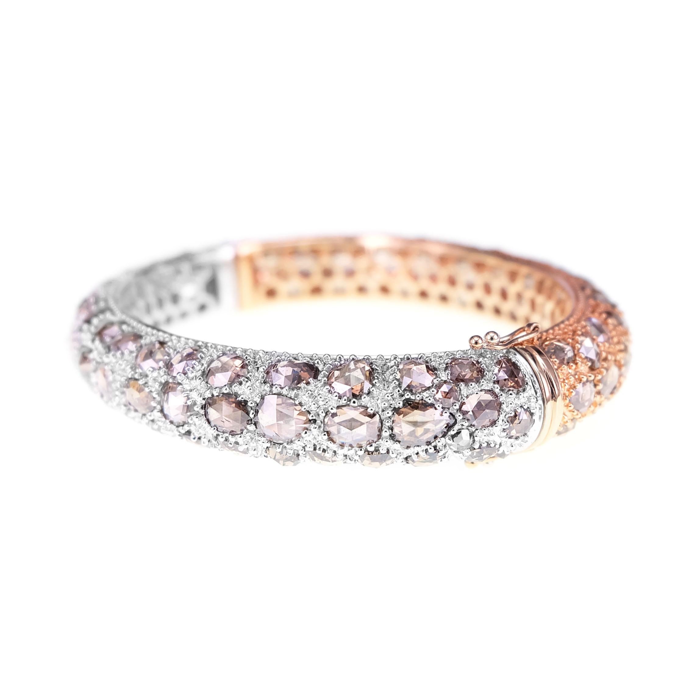 25.12 carats of brown rose cut are set in this multi purpose bangle. On one side, the diamonds are set in rose gold and on the other side on white gold. Depending on the mood and dress, you can use the bangle in both rose and white gold. 
The