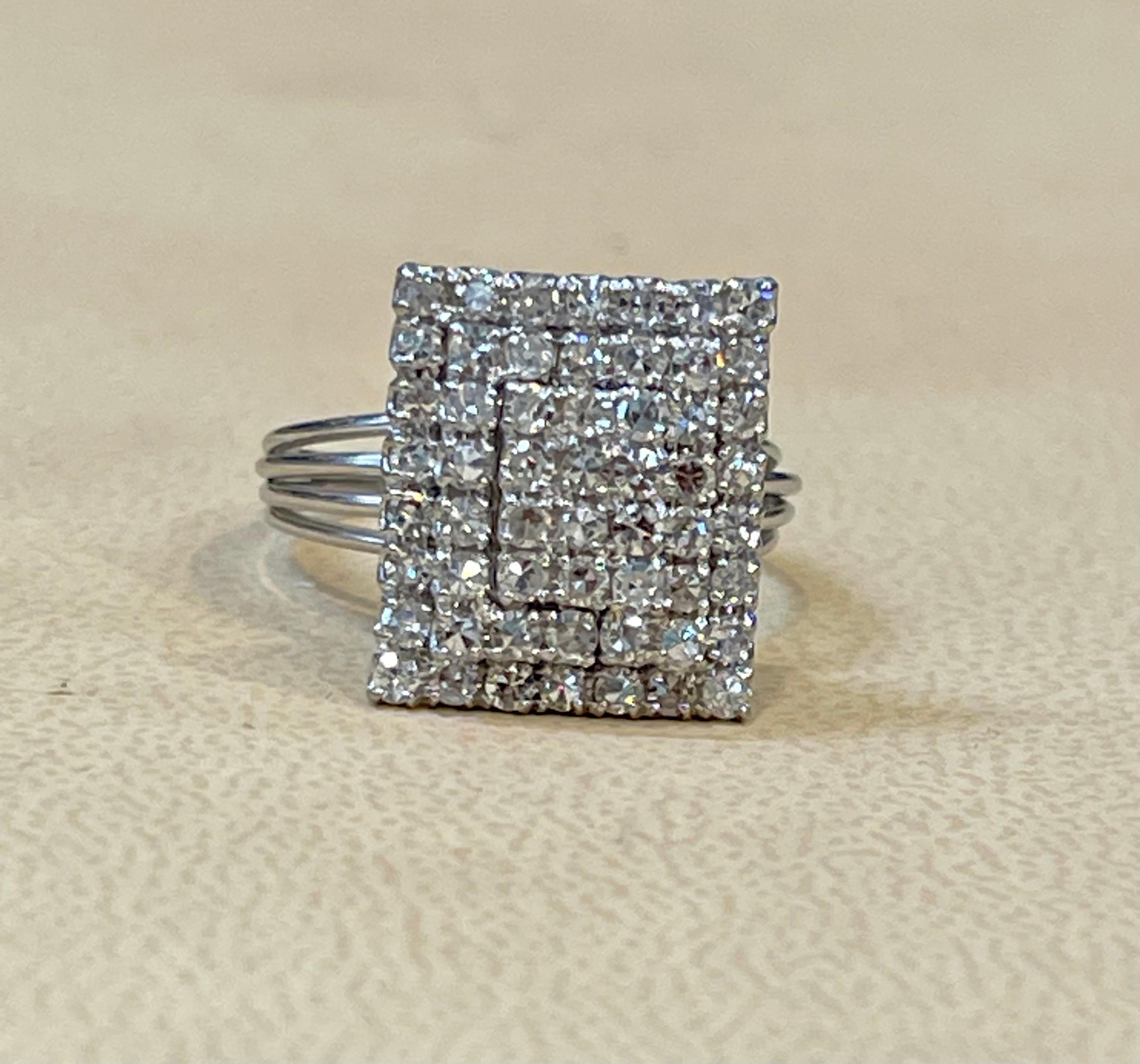 Approximately 2.5 Carat Diamond Cluster Cocktail Ring 18 Karat White Gold 6.8 Grams Ring
Brilliant round cut diamonds, Emerald cut shape has been created of the ring with rows of round diamonds.
Diamond SI to VS  quality and I/H Color
This is a very