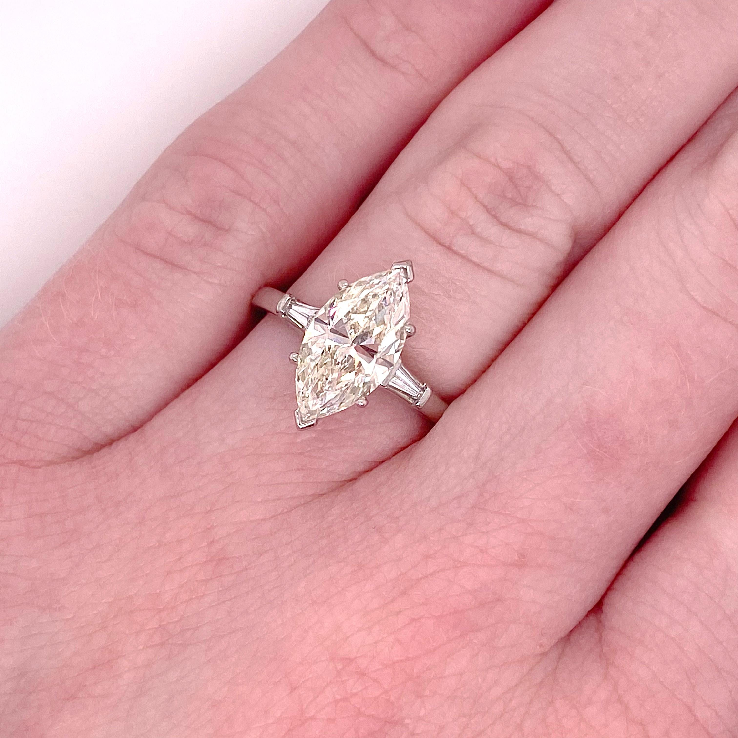 This 2.50 carat marquise diamond is stunning in this three stone ring! The baguette diamonds are great accents to this gorgeous marquise diamond.  The low profile of this ring is great if you want the ring to work with gloves or be practical for