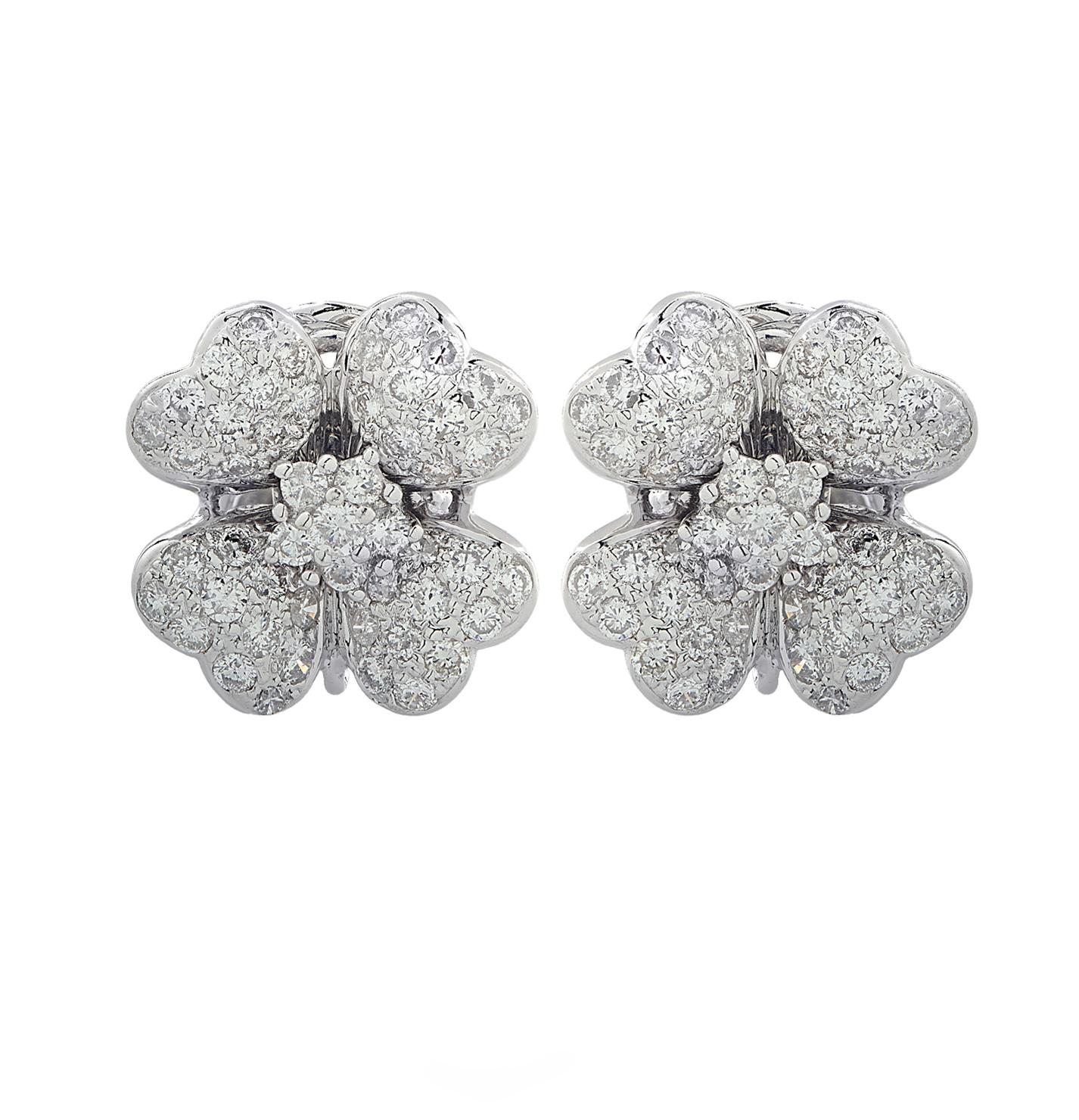 Delightful earring crafted in 18 karat white gold, featuring 100 round brilliant cut diamonds weighing approximately 2.5 carats total, G color, VS-SI clarity. The earrings are fashioned into four leaf clovers, adorned with diamonds, capturing the