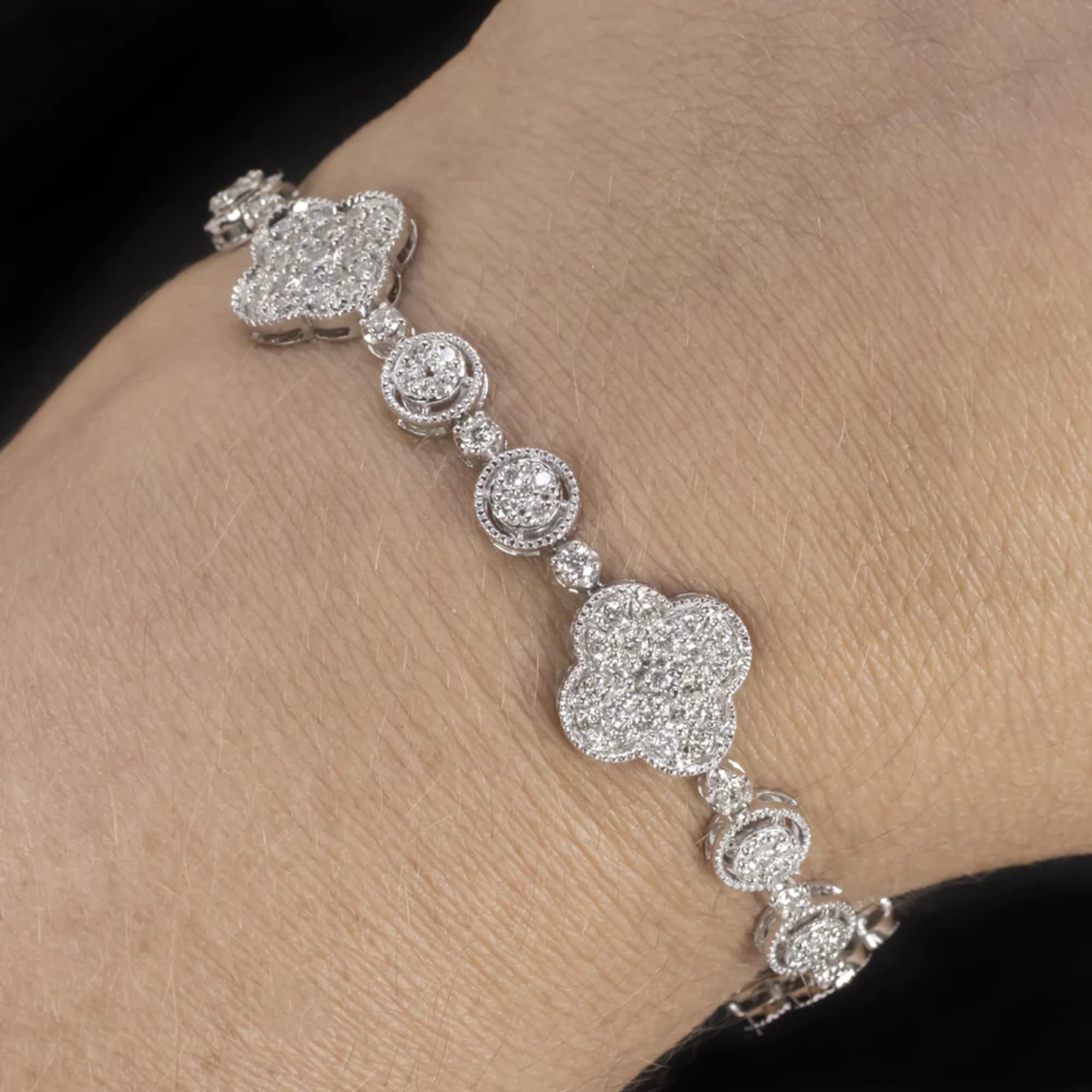 Introducing our breathtaking diamond bracelet, a true masterpiece of elegance and glamour. This exquisite piece is skillfully crafted to catch the eye and captivate the heart. Its unique design features a blend of round and clover-shaped clusters