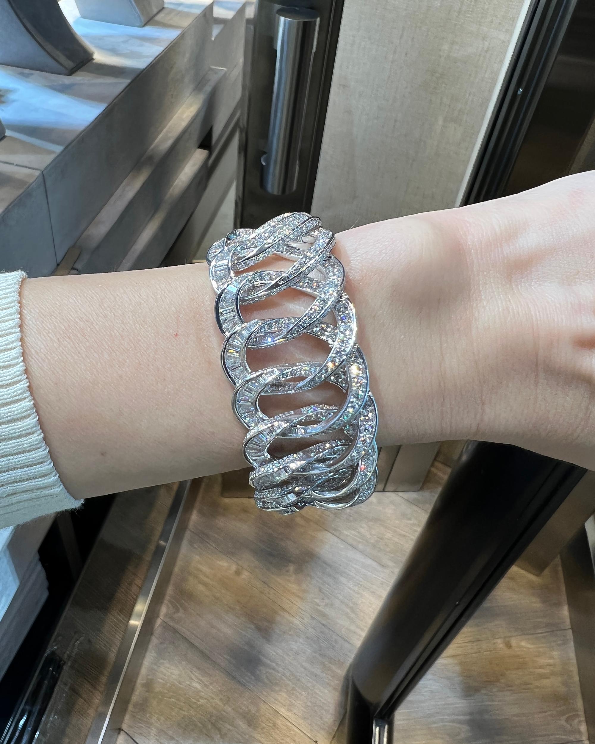 A link bracelet made with diamonds and 18k white gold by Spectra Fine Jewelry.
200 baguette diamonds weighing 4.36 carats.
1484 round diamonds weighing 15.77 carats.
201 tapered baguette diamonds weighing 4.92carats.
Total diamond weight is 25.05