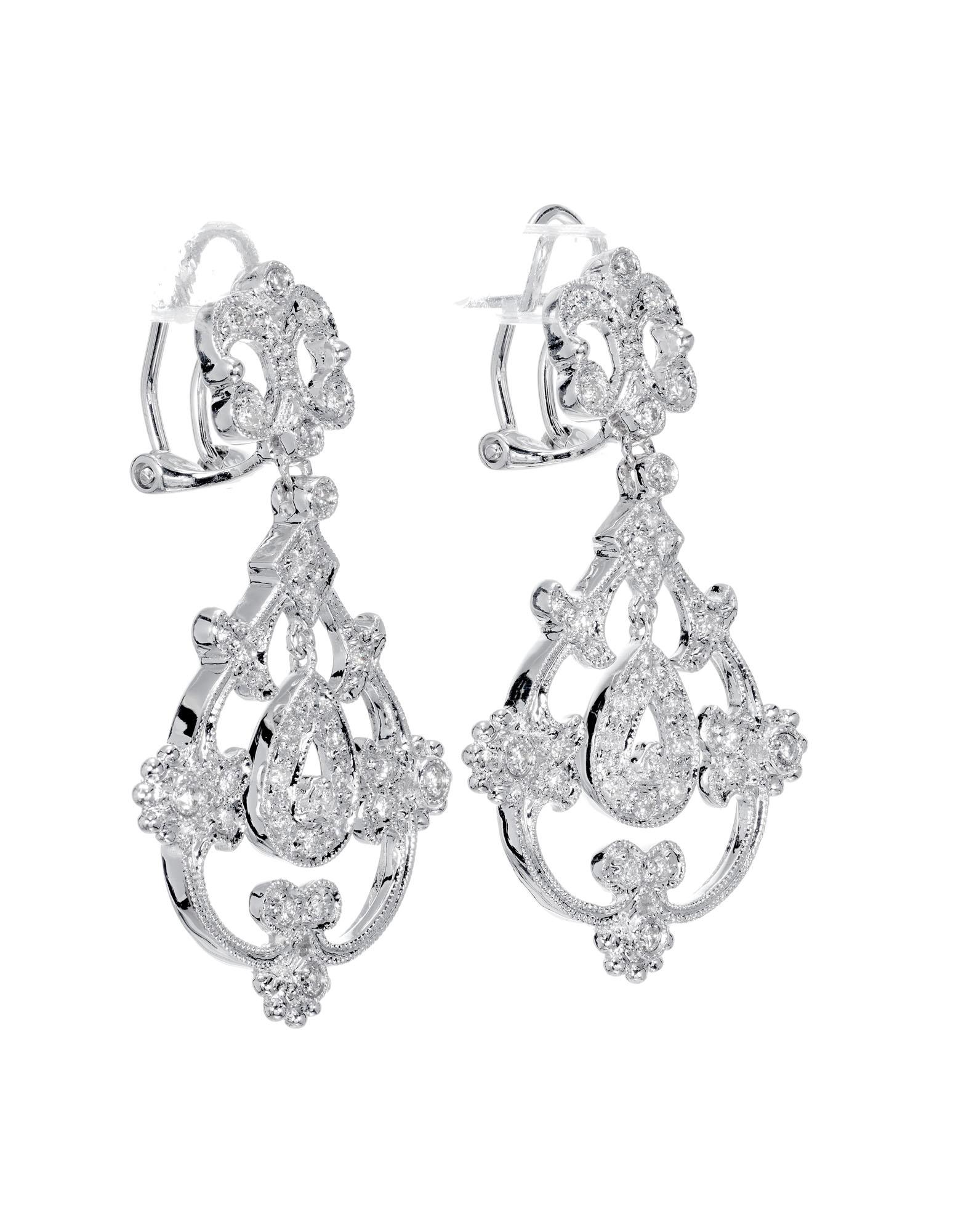 Open work diamond post clip dangle earrings. Set in 14 white gold with 62 round full cut diamonds.

62 full cut round diamonds. approx. total weight .25cts
Length: 1.36 inches or 34.61mm
Width: .81 inches or 20.68mm
7.4 grams
14k white gold