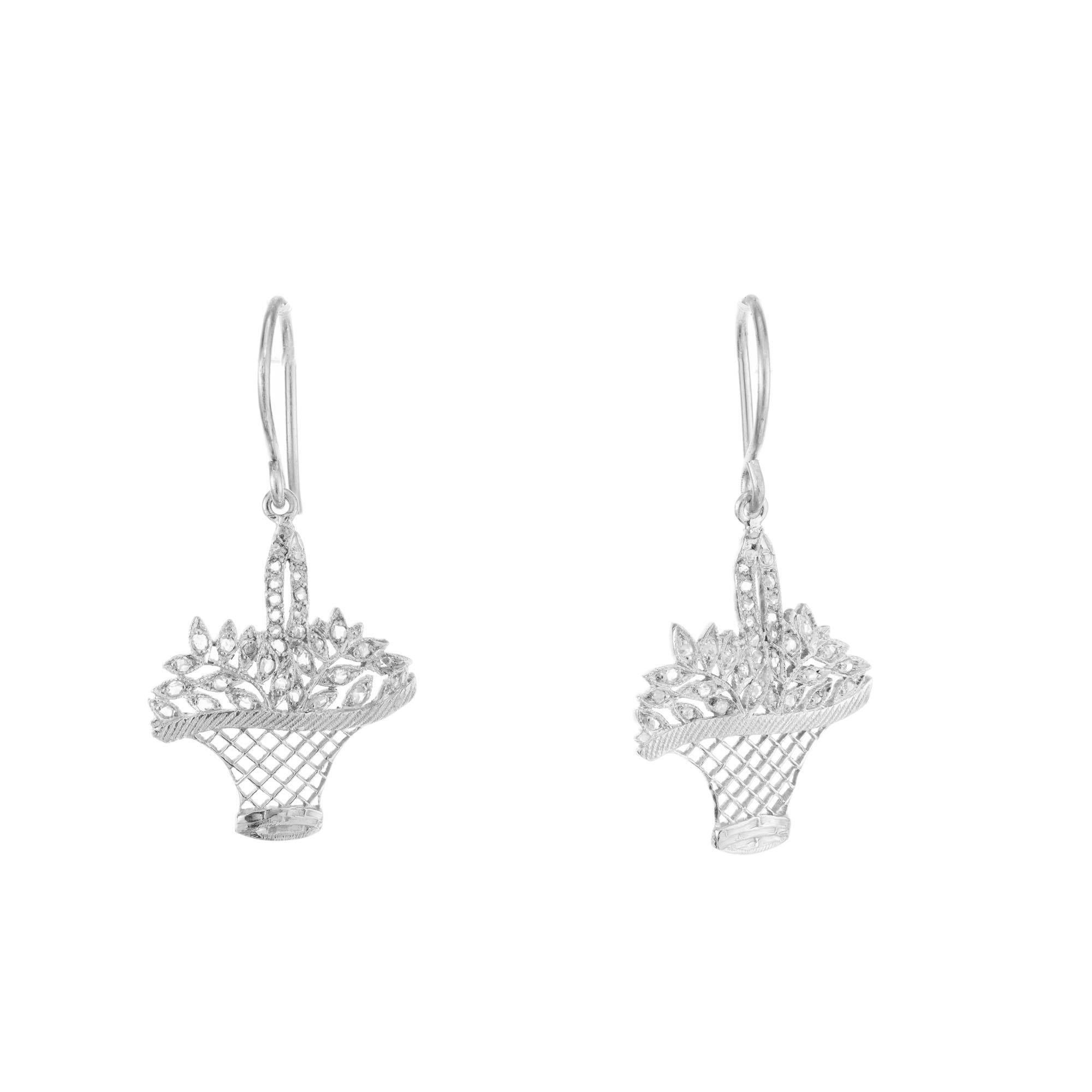 Vintage 1900's handmade basket dangle earrings set with 62 rose cut diamonds on simple wire hooks

62 round rose cut diamonds, H-I SI-I approx. .25cts
Platinum 
4.9 grams
Top to bottom: 34.6mm or 1 1/3 Inch
Width: 18.6mm or .75 Inch
Depth or