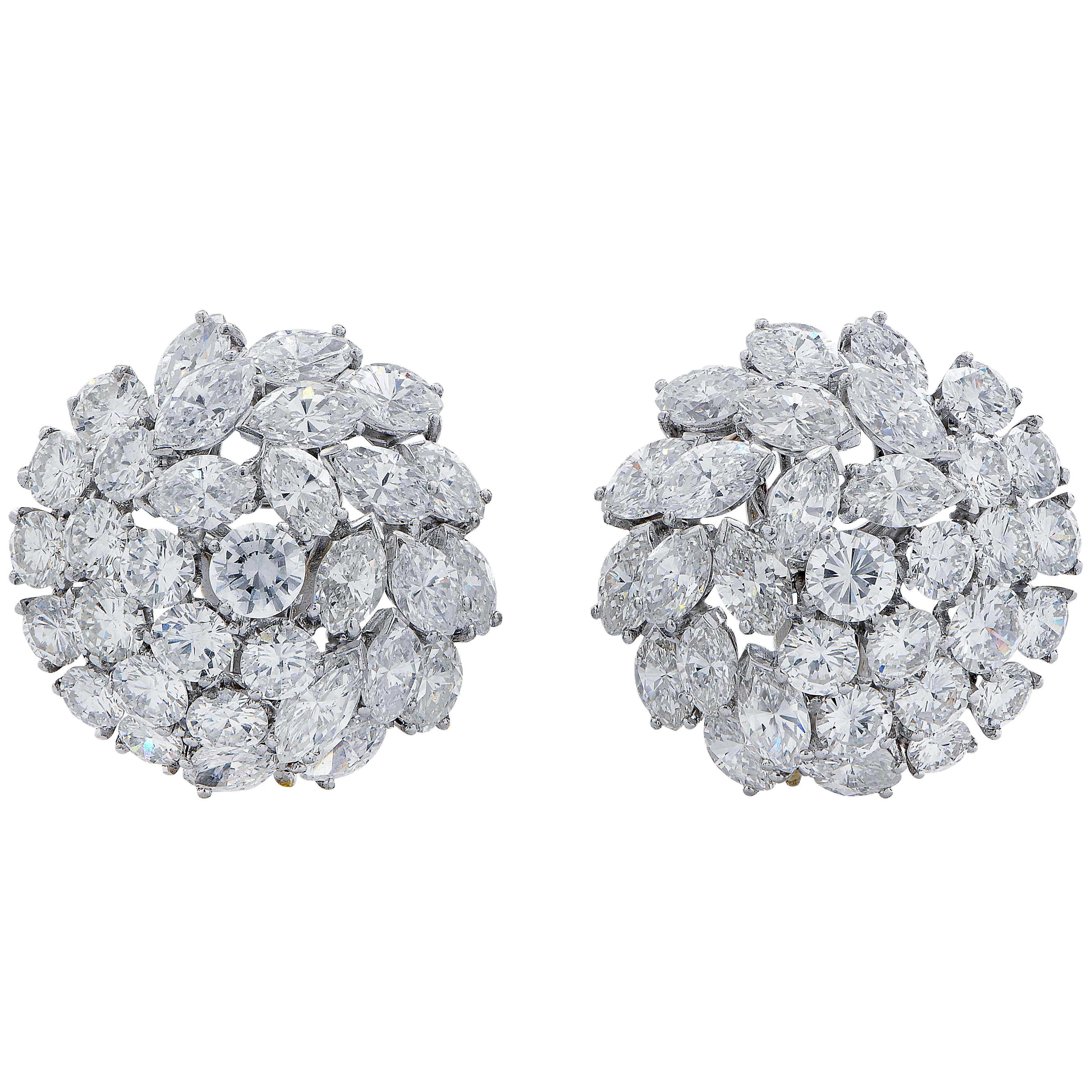 These beautiful diamond earrings are designed as curlers and bombe form set with prongs. Platinum ear clips feature 154 mix cut diamonds with an estimated total weight of 25 carats. F/G VS-SI. 
Detachable bottom section.
Metal Type: Platinum
Metal