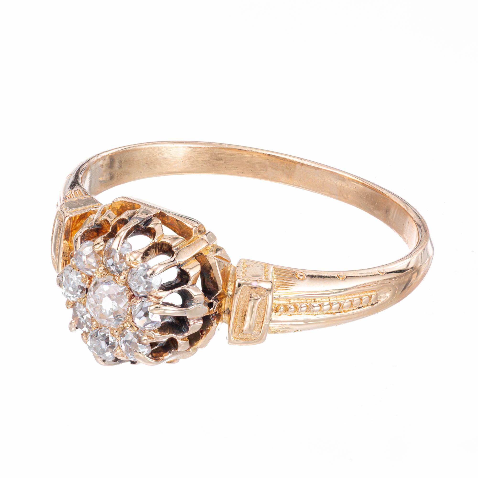 1840's Georgian cluster diamond engagement ring. 9 old mind diamonds set in a 14k yellow gold handmade setting.

9 Old Mine cut diamonds, I VS-SI approx. .25cts
Size 7.75 and sizable 
14k yellow gold 
Tested: 14k
3.5 grams
Width at top: 8.4mm
Height