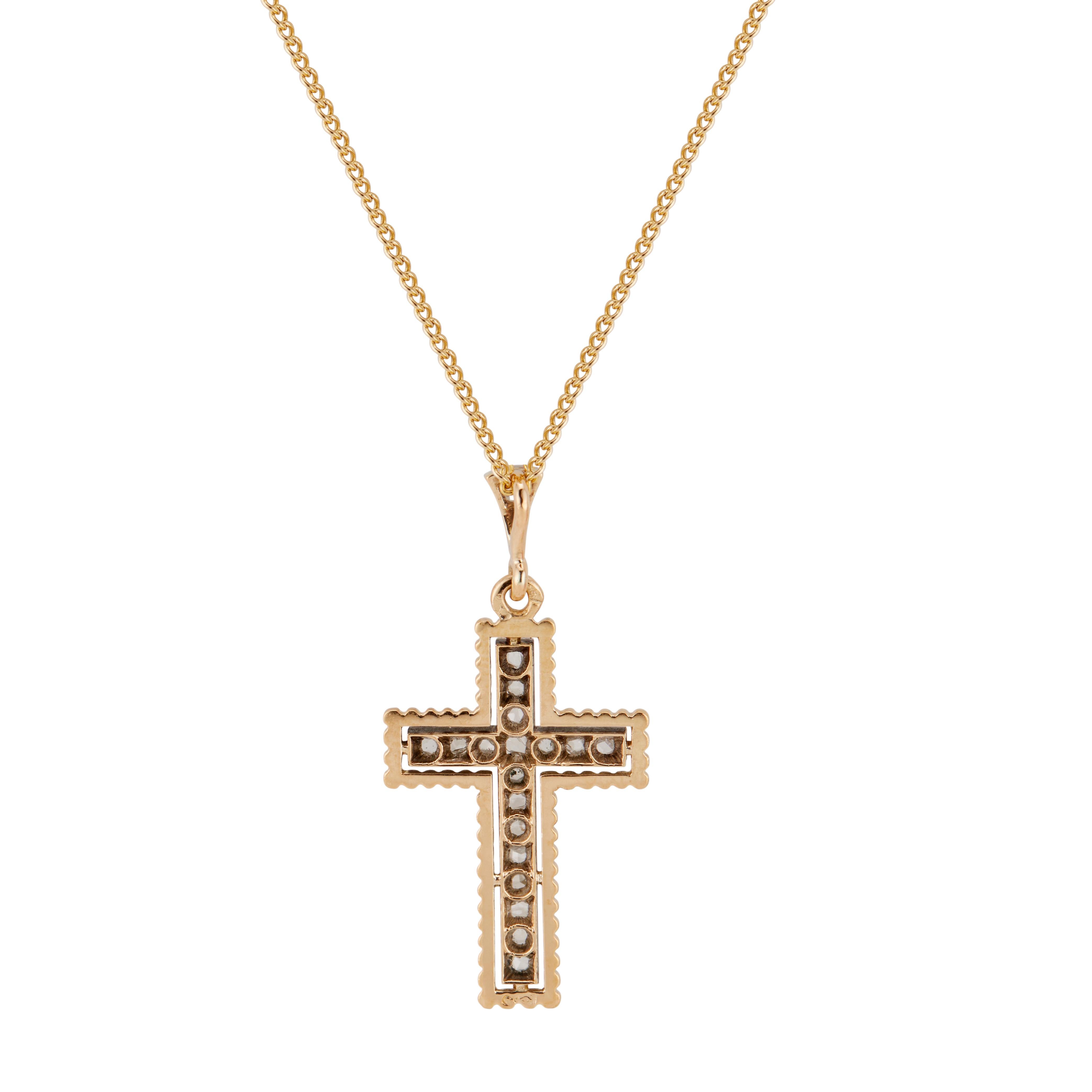 Estate 1920's diamond cross pendant necklace. 19 rose cut diamonds set in silver. The cross and chain are in 18k yellow gold. 16 inch chain. 

19 rose cut diamonds, G-H SI approx. .25cts
18k yellow gold 
Silver 
5.2 grams
Top to bottom: 36mm or 1.4