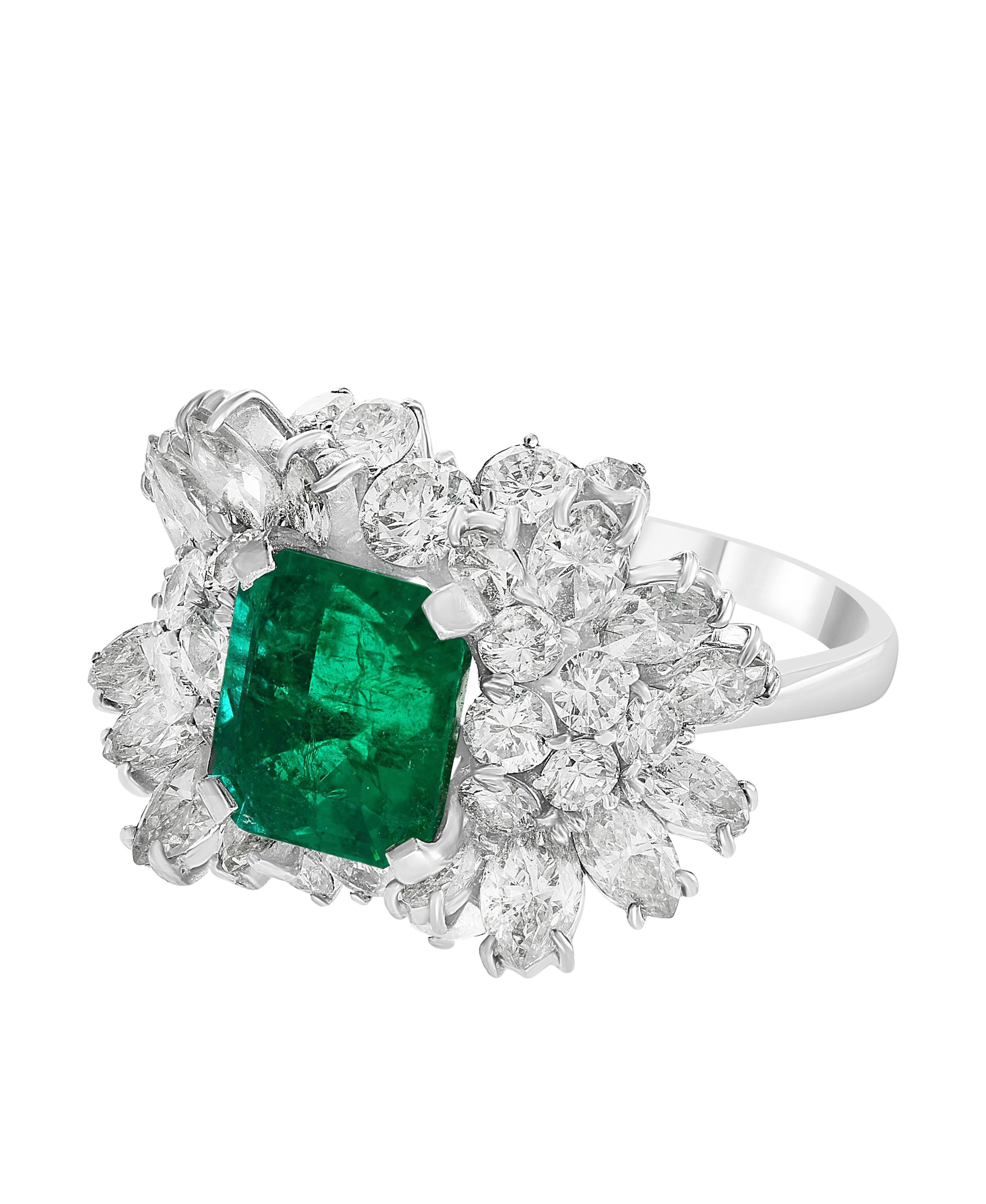 A classic, Cocktail ring 
2.5 Carat  Colombian Emerald and Diamond Ring,  with no color enhancement.
18 Karat white gold 6 gm
Ring size 6
 Diamonds: approximate 3.5 Carat 
Emerald:  approximate 2.5 Carat 
Origin : Colombia 
Color: Deep  Green,