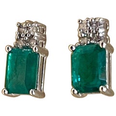 2.5 Carat Emerald Cut Emerald 
0.50 Ct Diamond Stud Earrings 14 Kt White Gold