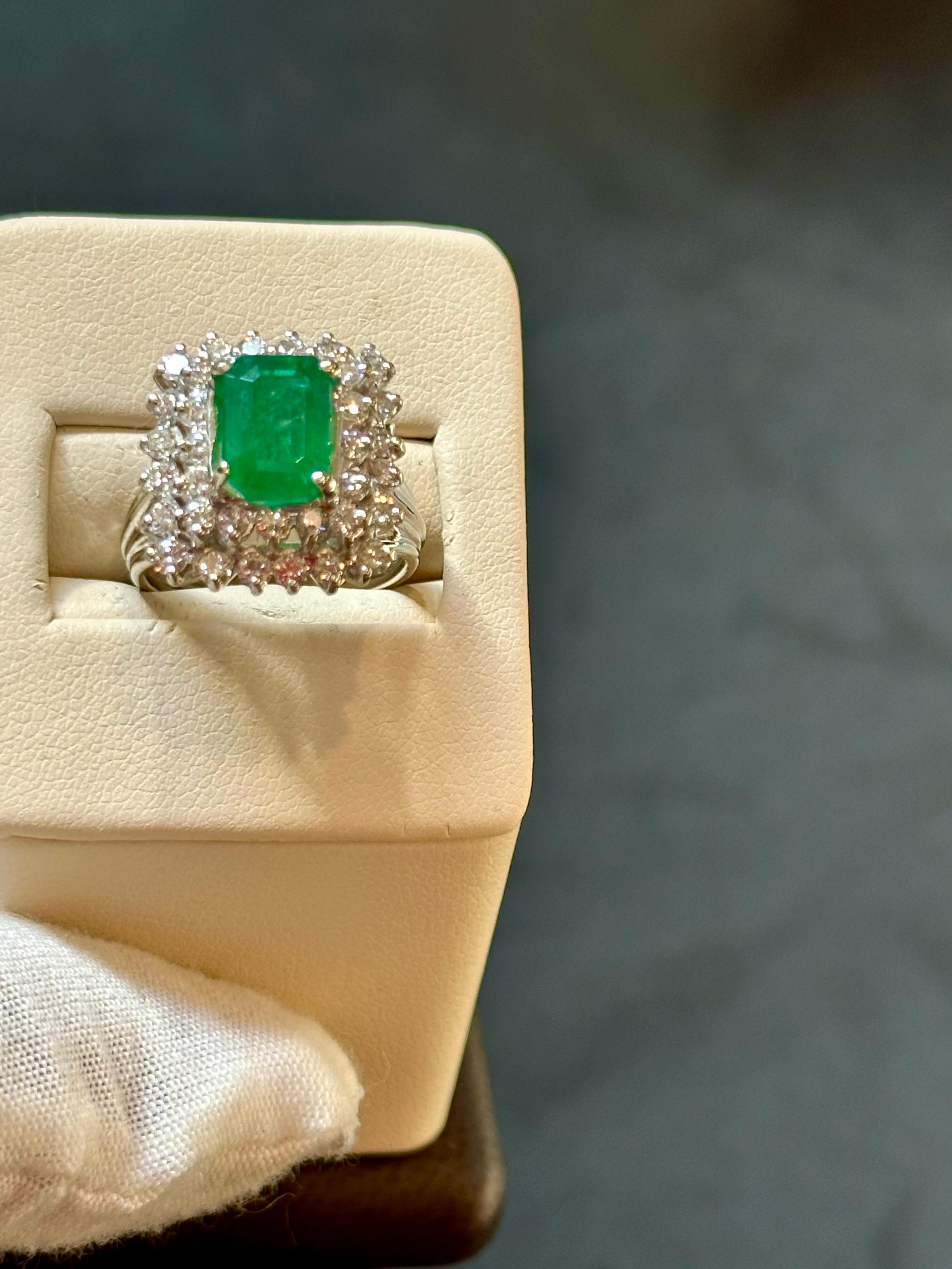 Women's 3 Carat Emerald Cut Emerald & 2 Carat Diamond Ring 14 Karat White Gold For Sale