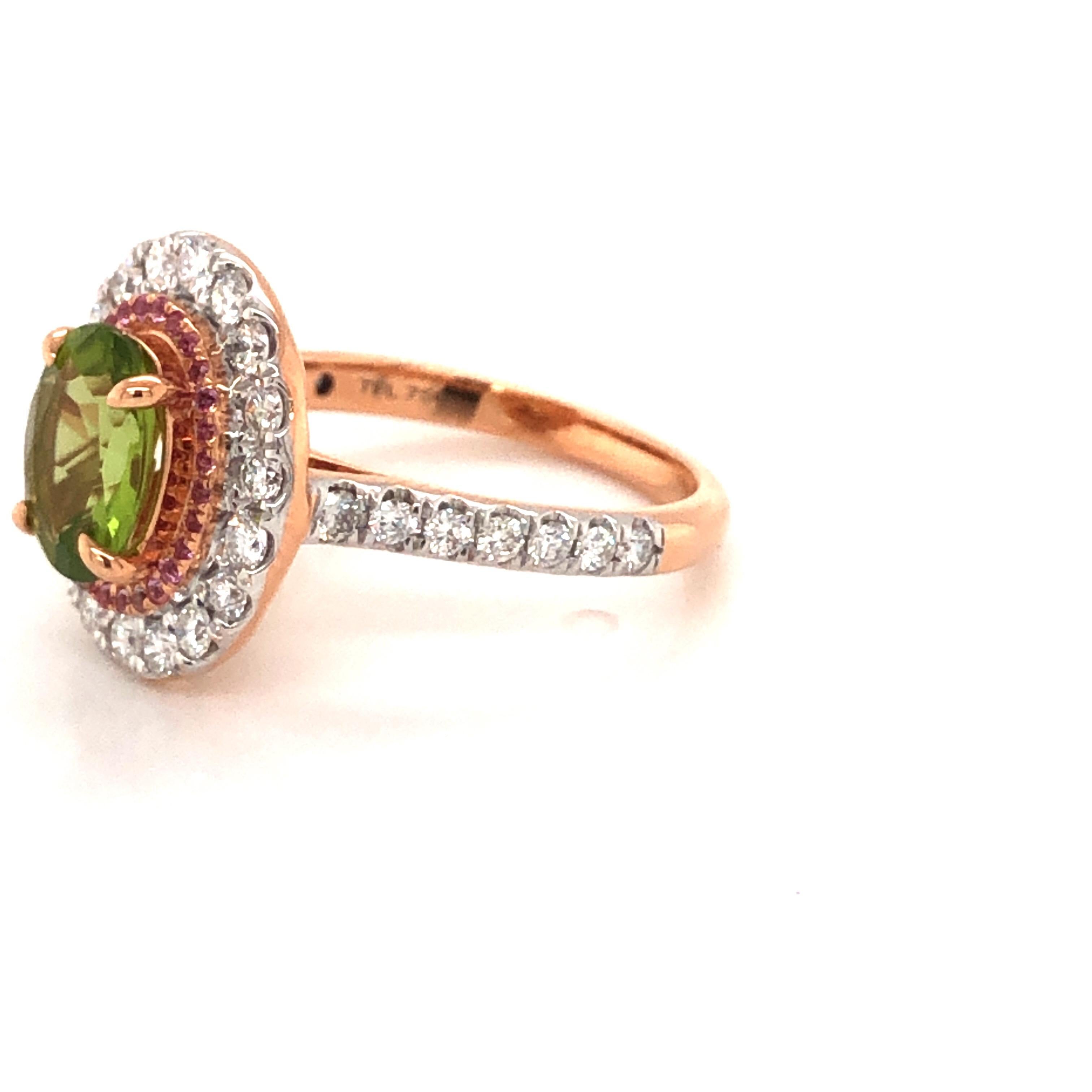 A bespoke and magnificent 18 karat rose gold ring with green peridot a pink sapphire halo and white natural round brilliant cut diamonds for outer halo and top part of the shank. Ideal as an engagement, dress or a cocktail ring. Can be customised in
