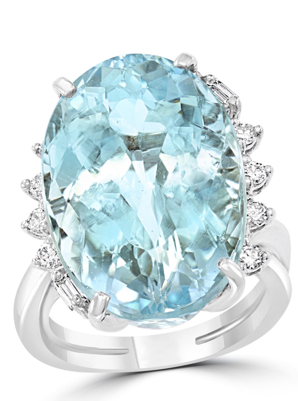 25 Carat Natural Aquamarine & Diamond Cocktail Ring  18 K Yellow Gold , Estate
A classic, Cocktail ring 
Huge 25 Carat of very clean no inclusion  Aquamarine Oval shape , full of luster and shine but light in color 
0.5  Carats of Brilliant diamonds