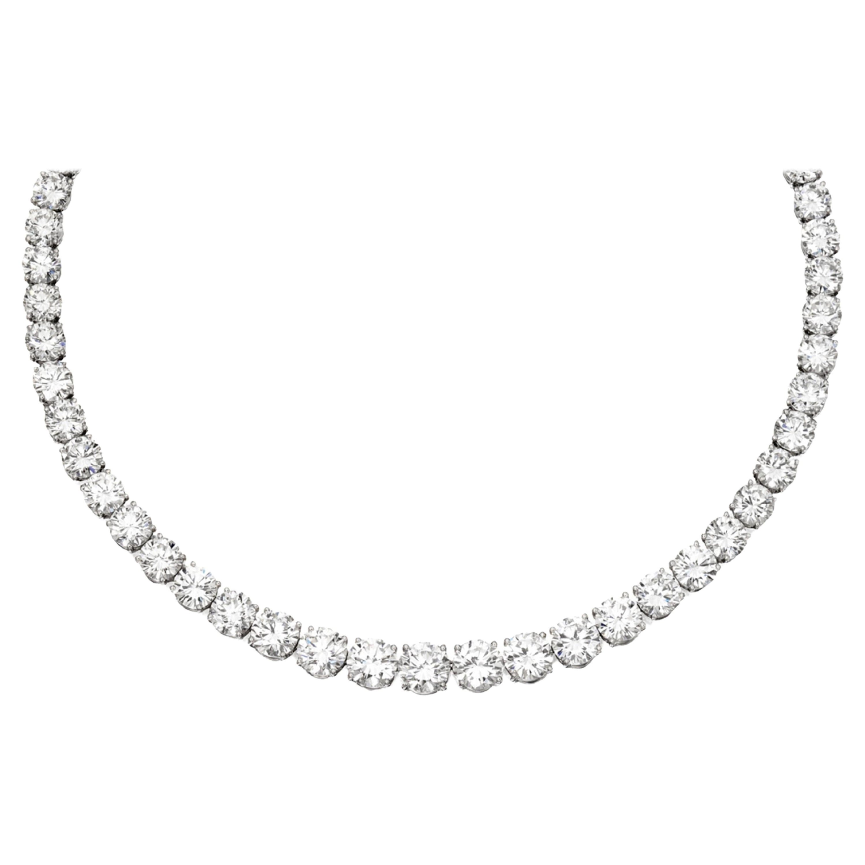  breathtaking Four-Prong 25 CT TW Natural Diamond Full Tennis Necklace, meticulously crafted to grace the neckline with unparalleled brilliance and sophistication.

Expertly fashioned from shimmering 18K white gold, this necklace showcases a