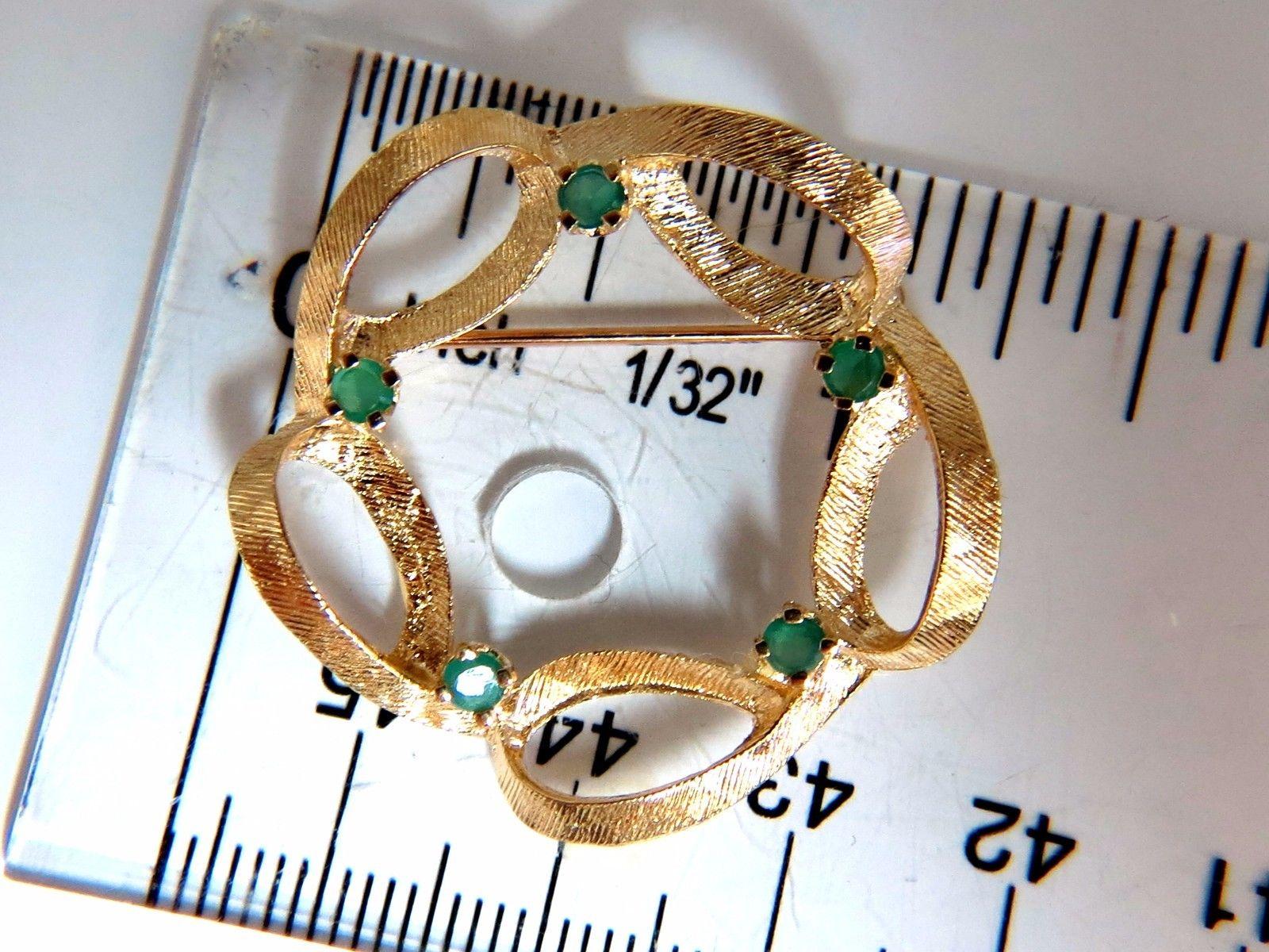 Emerald Circular Brooch

.25ct. natural emeralds

Rounds, Full cut Brilliant.

14kt yellow gold 

4.5 grams.

Overall: 1.3 inch diameter