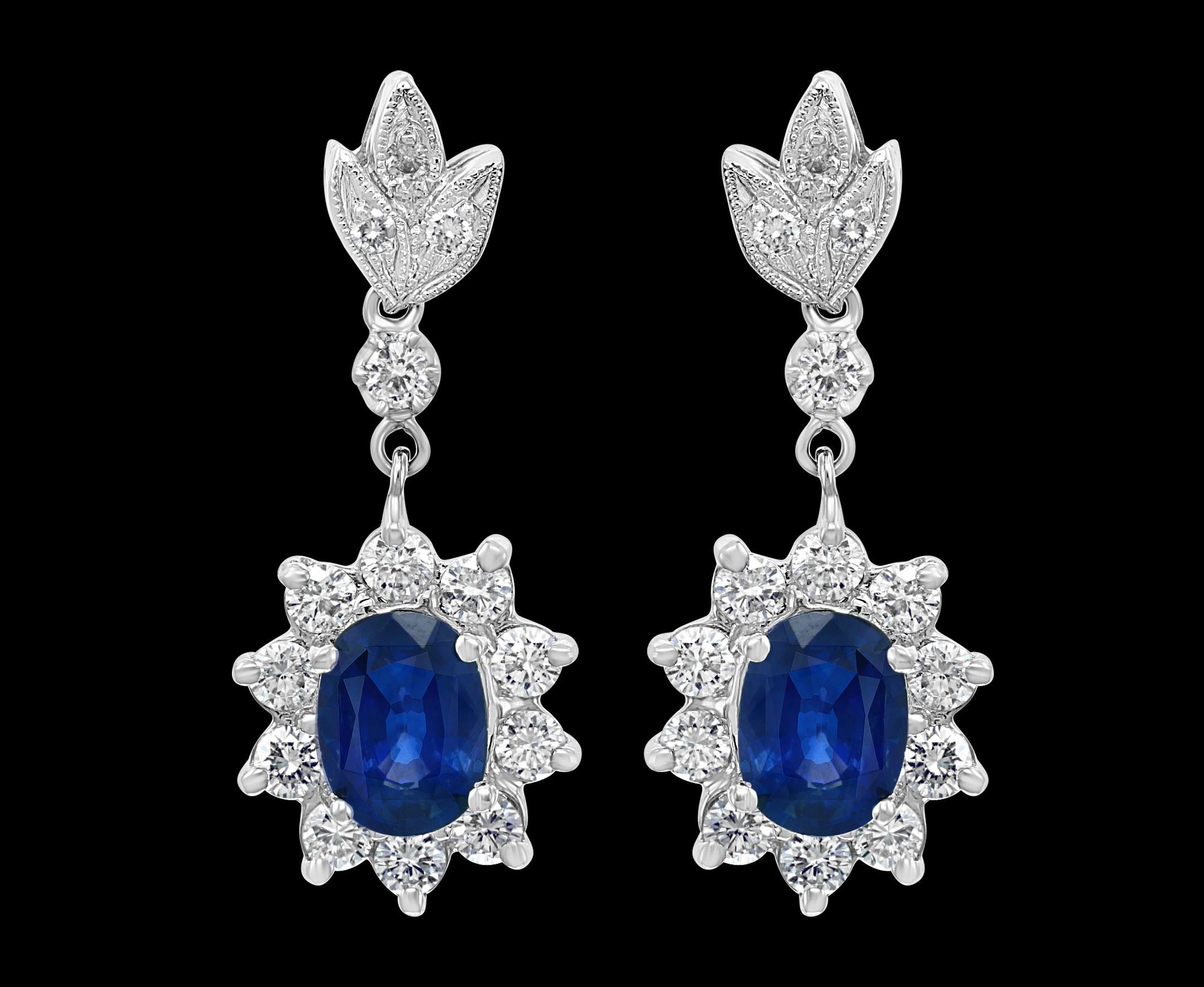 
2.5 Carat Natural Sapphire and 2.0 Carat Diamond Hanging Earring 14 Karat Gold
 perfect pair made in  14 Karat white gold . 
14 K gold 7 Grams
 Diamonds: approximate 2.0 carat , Very nice shiny diamonds , all eye clean with lots of bling 
Sapphires