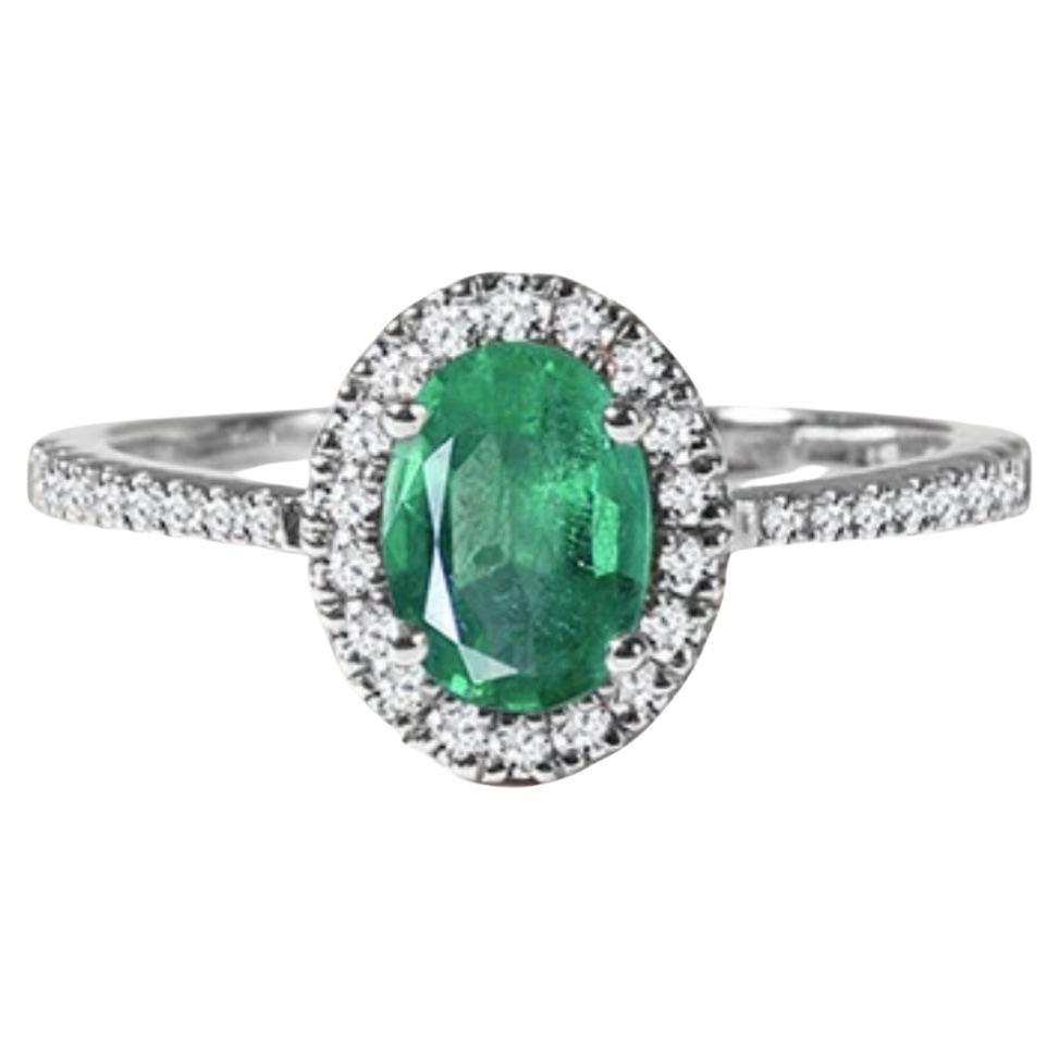 Introducing a truly stunning piece, behold the 2.5 Carat Oval Natural Zambian Emerald & 1.25 ct Diamond Ring in exquisite 14 Karat White Gold. This ring boasts a magnificent natural Zambian emerald, meticulously cut to perfection, weighing