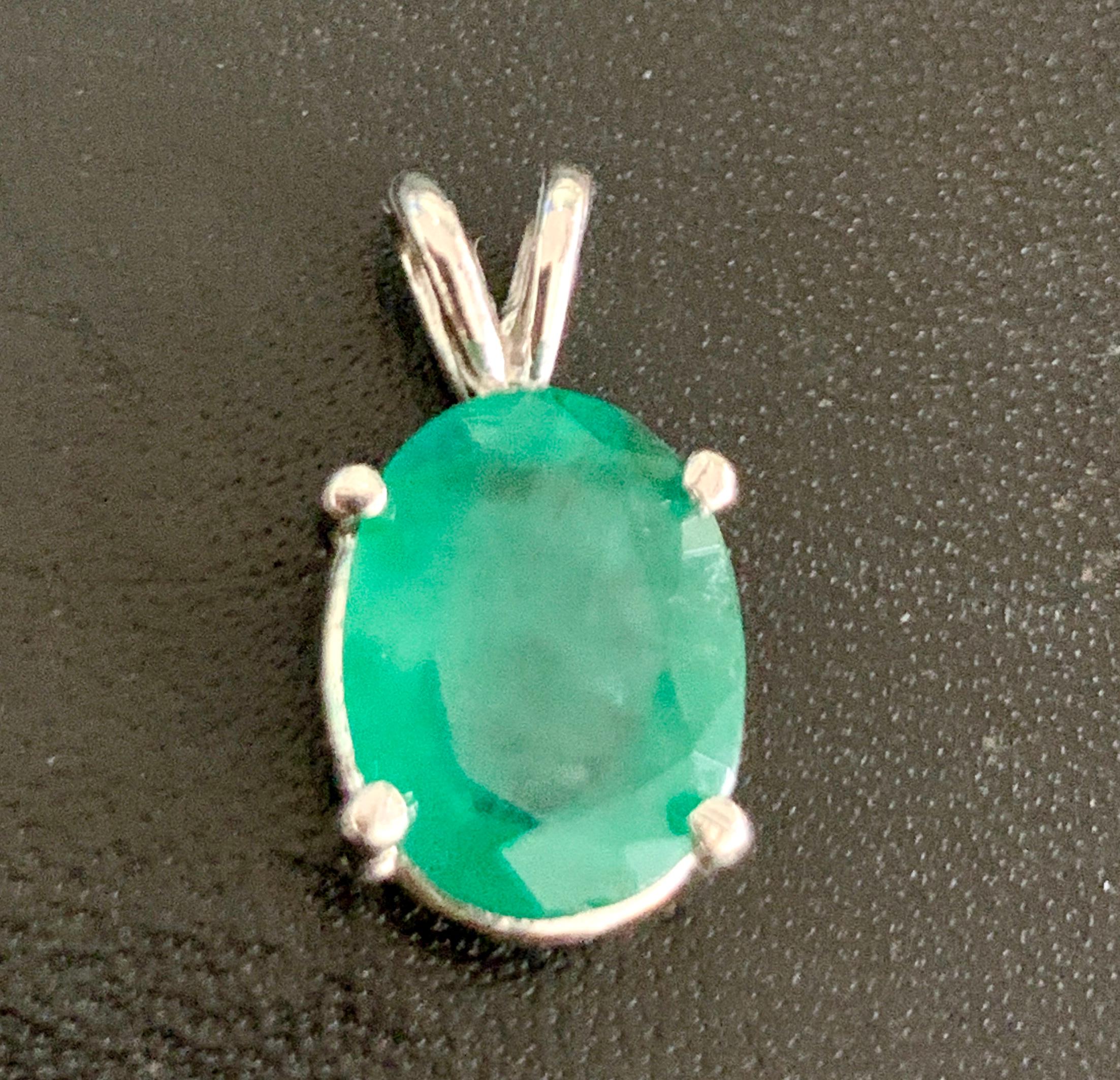 Approximately 2.5 Carat Oval Shape Emerald Pendant / Necklace 14 Karat White  Gold With Chain
This Simple yet elegant Necklace consisting of a single oval shape emerald with a solid 14 Karat White gold chain
Measurement of the stone roughly