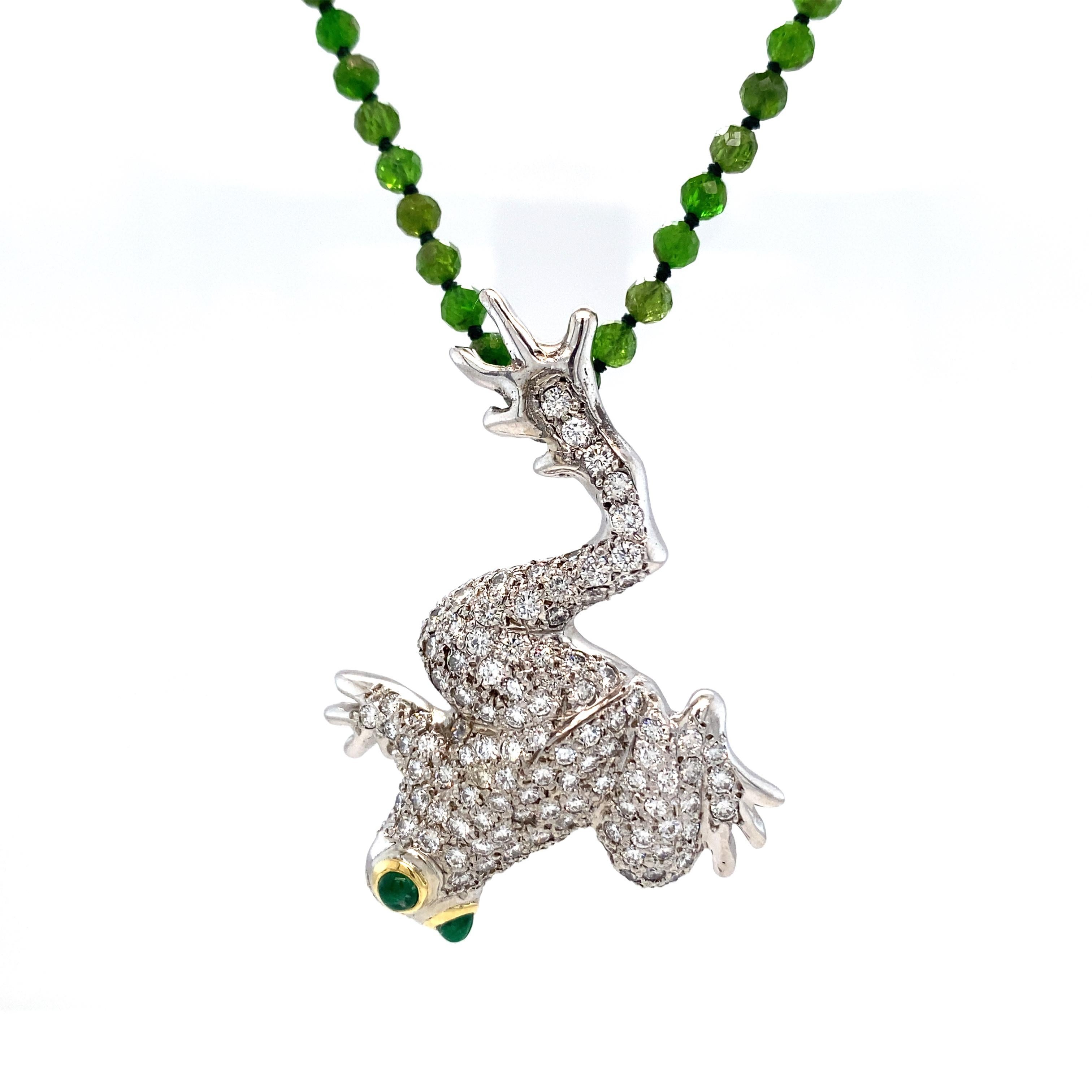 This is a custom design made in 1998 by San Diego jeweler Lawrence Poon.  When he hopped into our lives, this frog was a pin, but The Boss felt he would make a cool pendant, especially with double bales so that you can wear him diving into your
