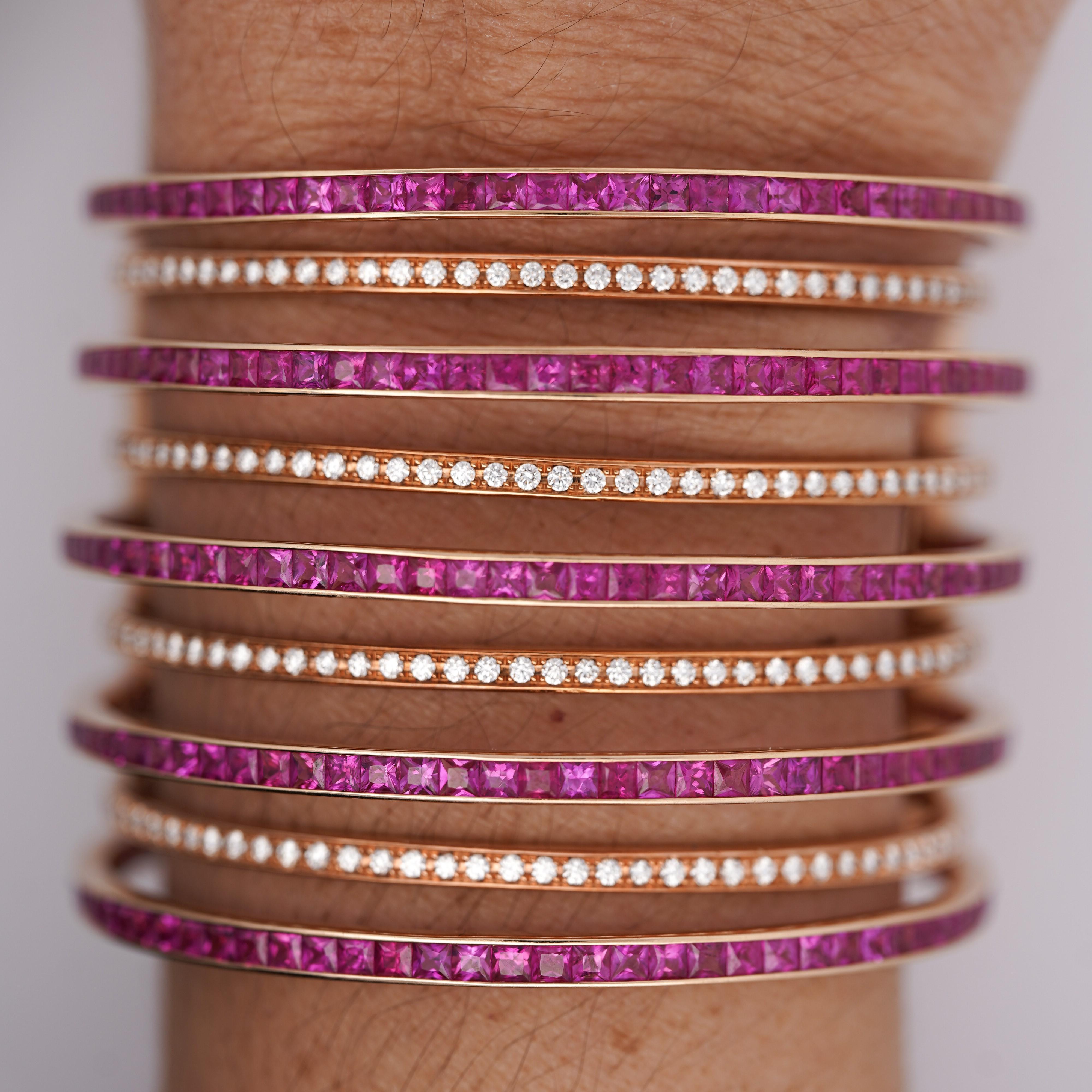 22 Carat Square Cut Pink Sapphire With 3.03 Carat Round Cut Diamonds in 18K Rose Gold Multi-Row Cuff Bangle Bracelet, Clip-On Closure, 108.5g.

Details:
Item Type: Cuff Bangle
Metal: 18K Rose Gold
Weight: 108.5 Grams
Width: 2 inches (3.5mm width per