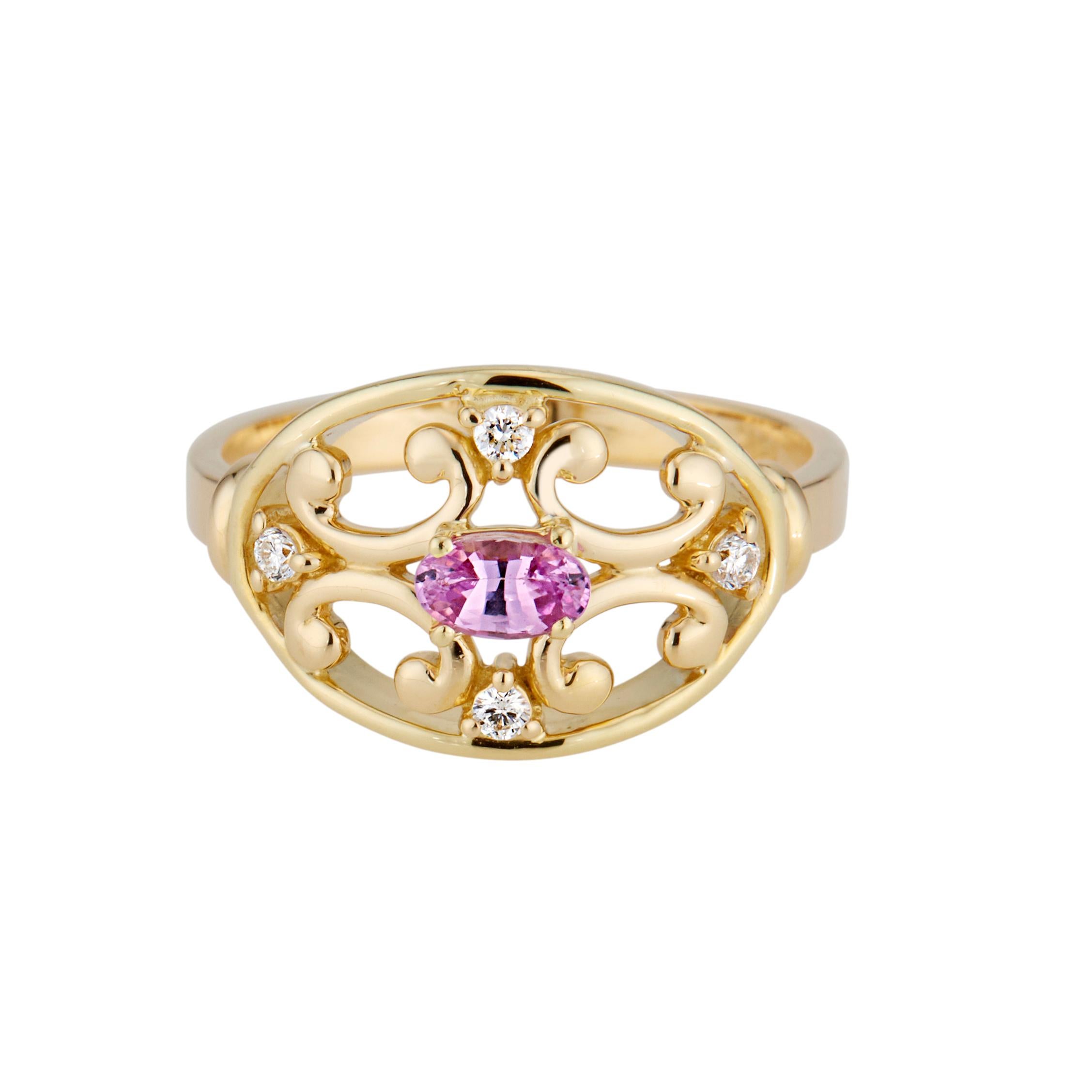 Sapphire and diamond open work ring. Pink Oval sapphire in an open work 18k yellow gold Etruscan style setting with 4 round brilliant cut accent diamonds. 

1 oval pink sapphire, VS approx. .25cts
4 round brilliant cut diamonds, G SI approx.