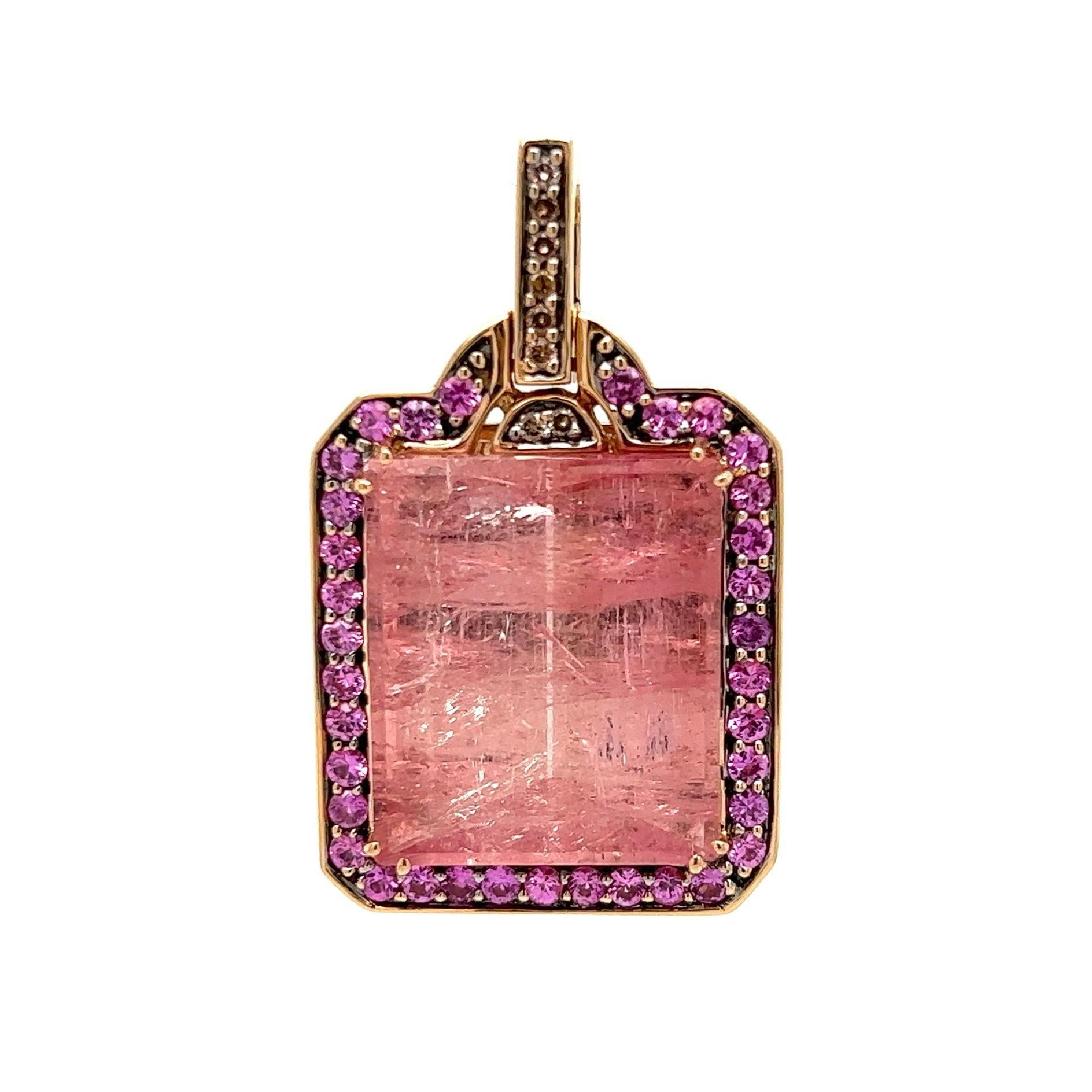 Simply Beautiful 25 Carat Pink Tourmaline and Sapphire Designer Pendant Necklace by Robert Wander. Center securely Hand set with a 25 Carat Pink Tourmaline surrounded by Pink Sapphires. Hand crafted in 18K Yellow Gold. Marked, 750, WINC. Suspended