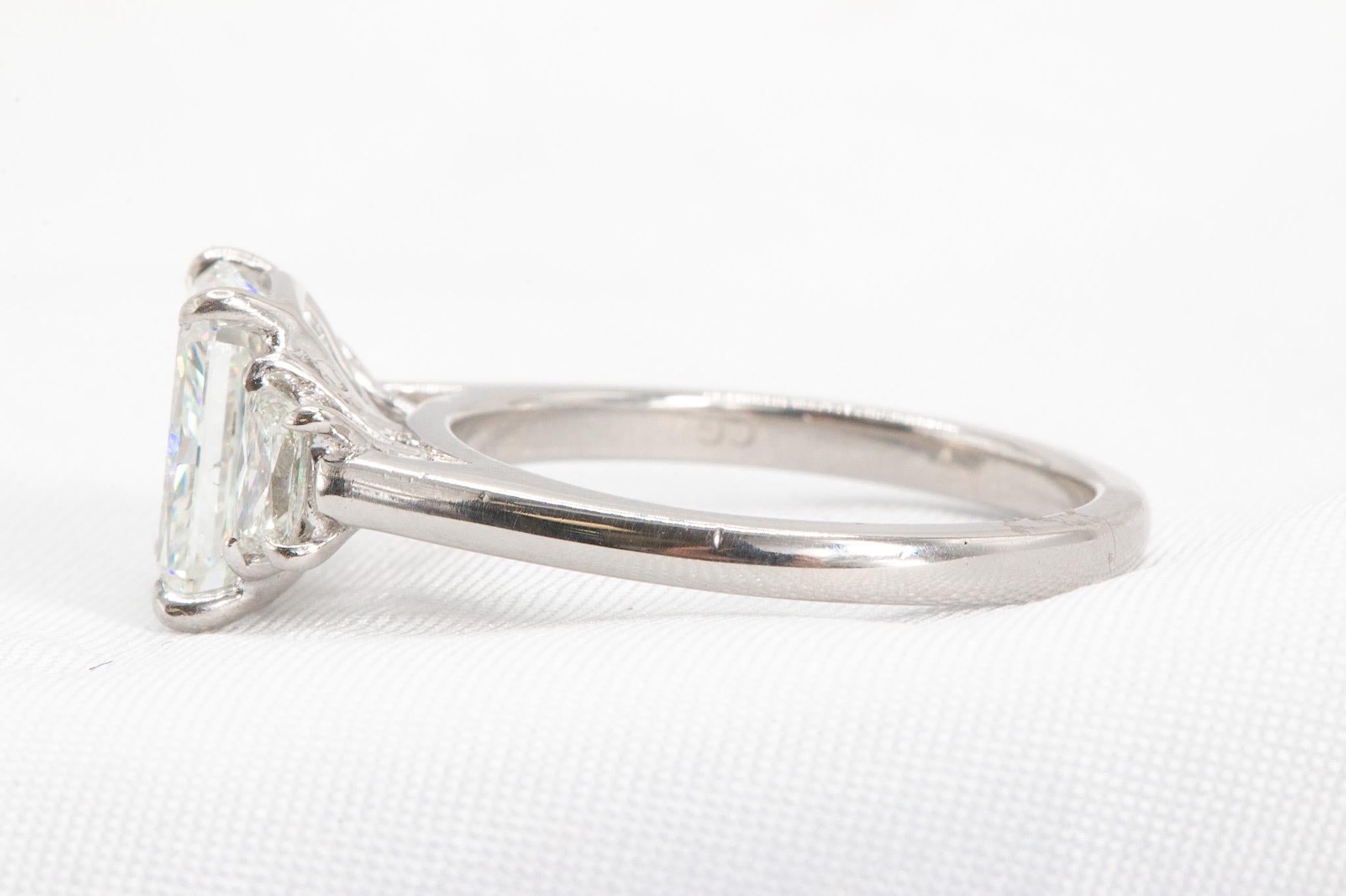 This exquisite platinum ring features a dazzling 2.5-carat radiant-cut diamond at its center, graded I color and VS2 clarity, exuding timeless elegance and sophistication. Accompanied by its original GIA certificate (#2215722346), the center diamond