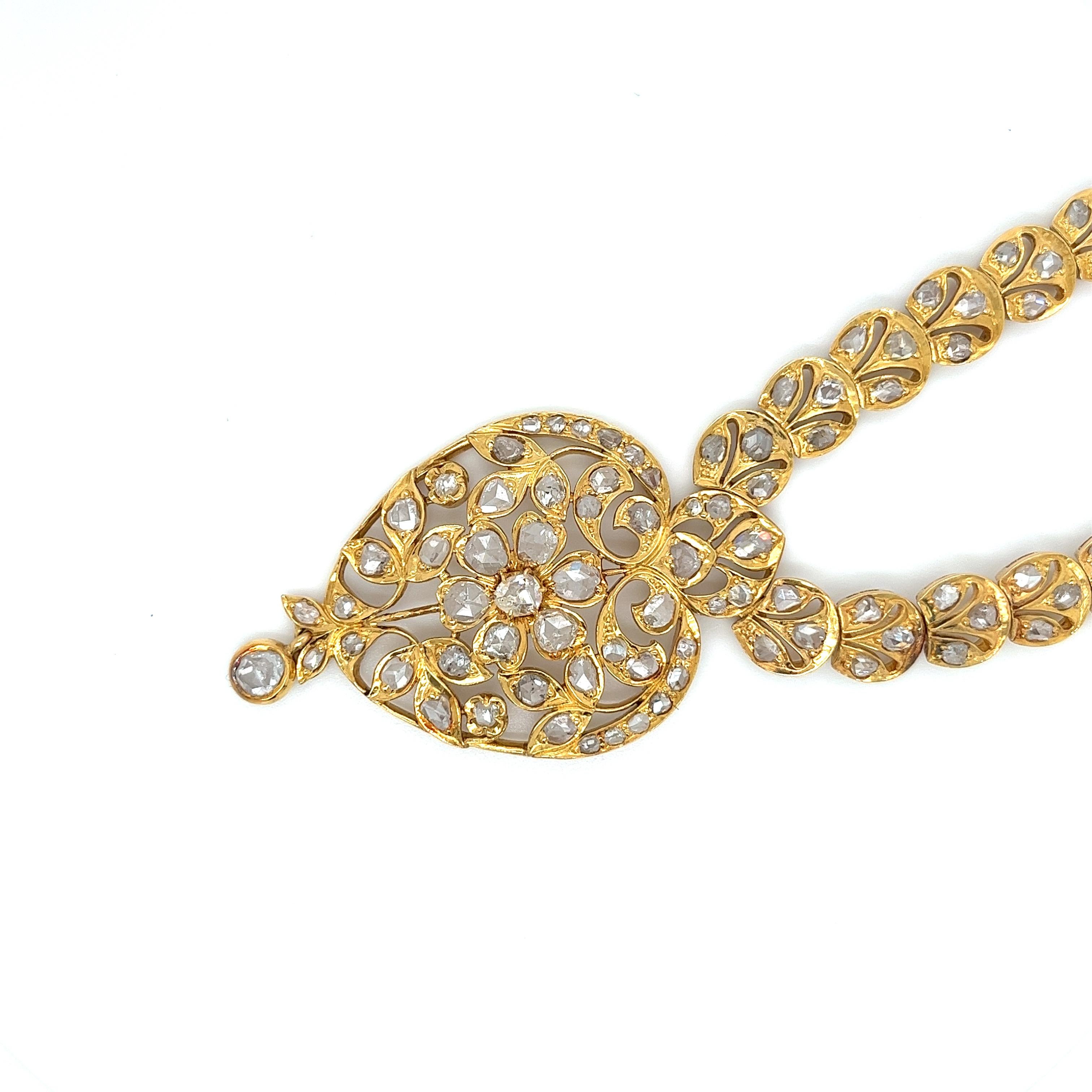 A Victorian-inspired Rose Cut White Diamond and 22K Yellow Gold necklace. Featuring 116 Rose-Cut White Diamonds totaling roughly 25 carats and set in 49 grams of 22K Yellow Gold.

Details:
✔ Stone: Diamond
✔ Cut: Rose Cut
✔ Stone Weight: ~25