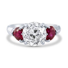 2.5 Carat Round Cut Diamond and Ruby Estate Three-Stone Ring in Platinum