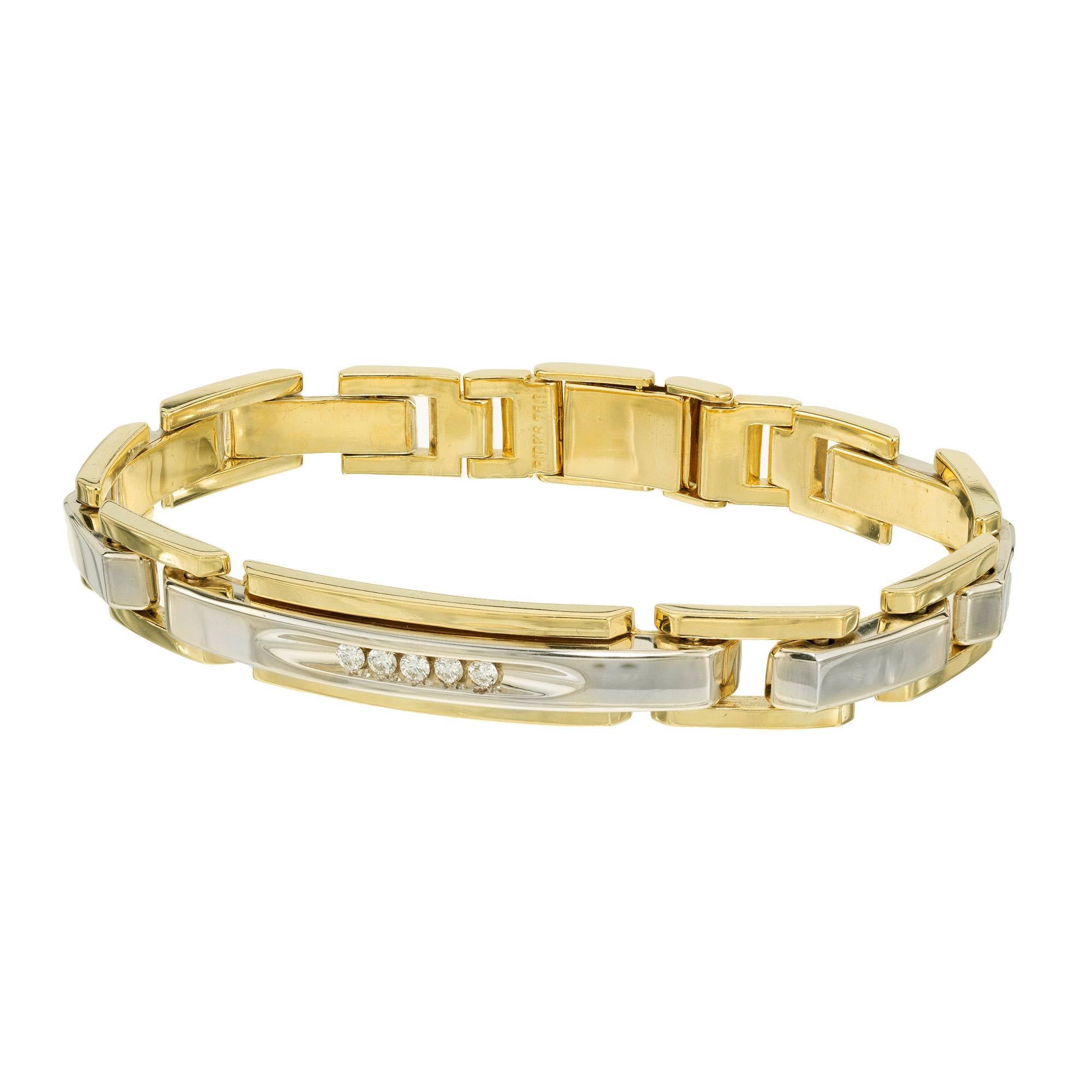 Mid Century 1960's Unique ID style diamond men's bracelet. Crafted in solid 18k yellow gold the links are connected by solid 18k white gold connectors. The bracelet is adorned with 5 round brilliant cut diamonds. It has a secure box catch. The