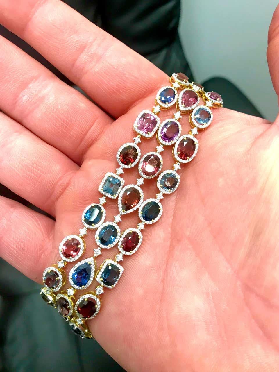 
A stunning display of spinels each different shape, size, and color giving this rainbow colored bracelet a spectacular look on any wrist.  This is a very sexy and feminine bracelet, an asset to any ladies wardrobe 

Each spinel weighs between