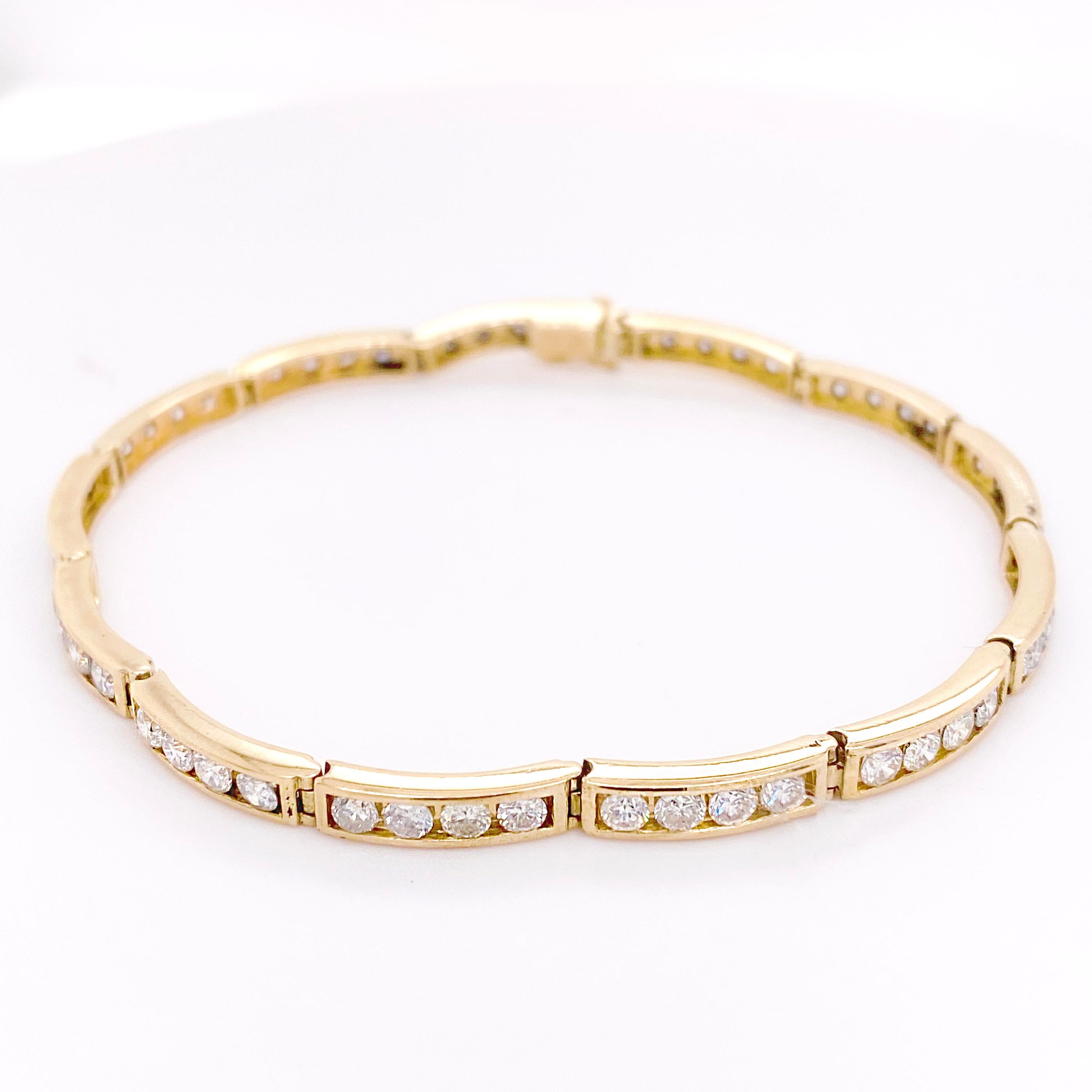 This 14 karat yellow gold tennis bracelet has a total of 2.50 carats of diamonds and measures 7.25 inches long. The design is made of unique curving channels to follow the curve of your wrist as the diamonds nestle securely in the channels. The